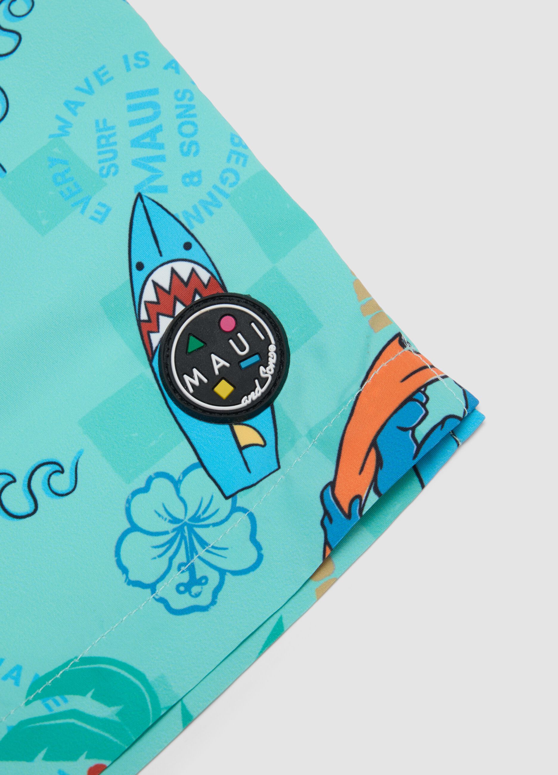 Blue boys&rsquo; swim shorts with tropical print