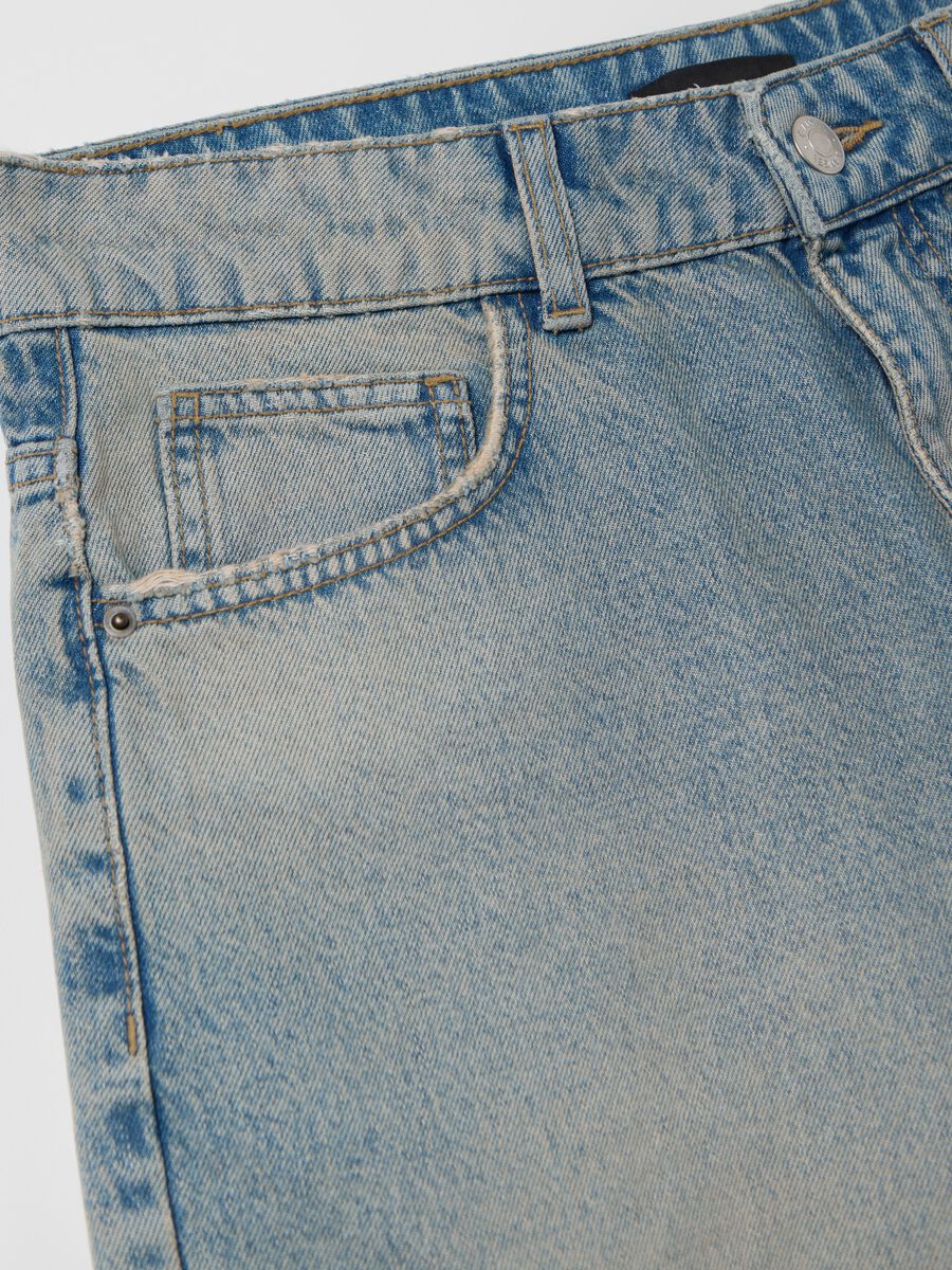 Light blue denim shorts with ripped details_5
