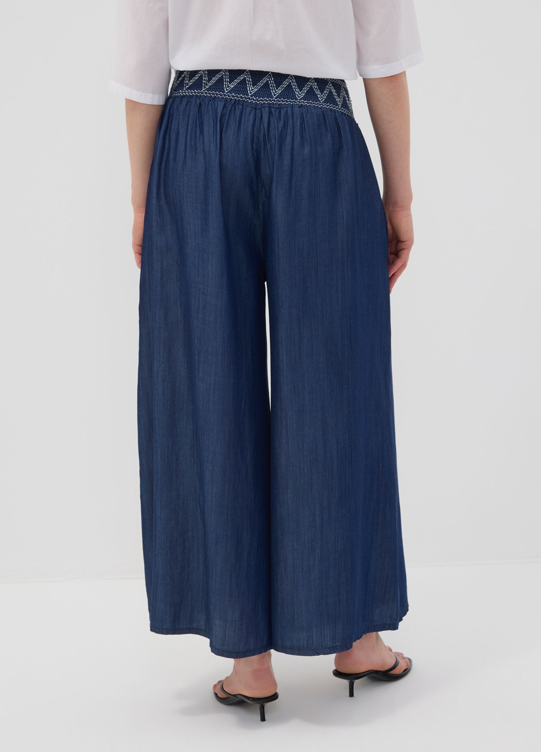 Wide-leg blue formal trousers in pure lyocell with embroidered waistband
