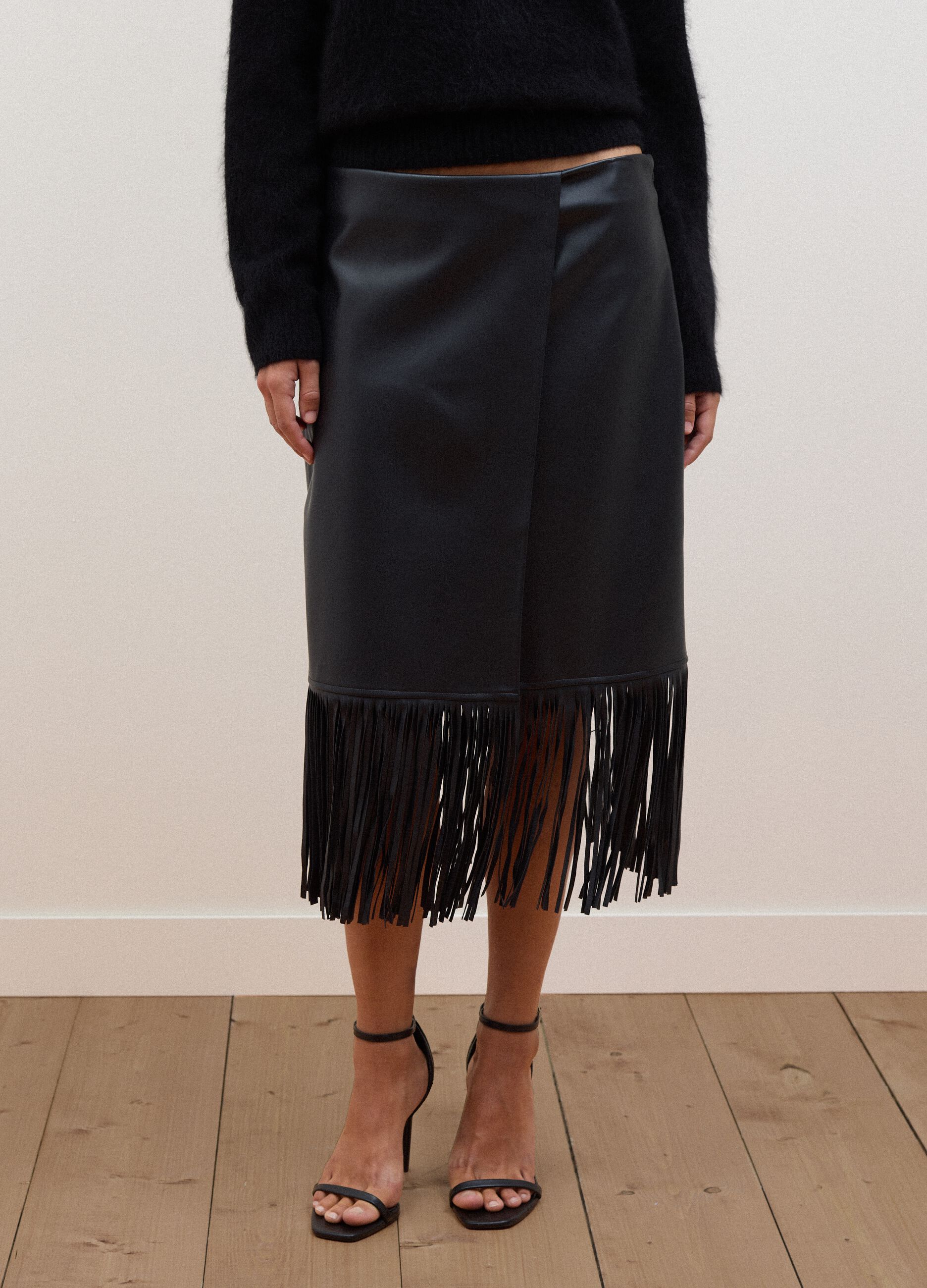 Black midi skirt with fringe hem