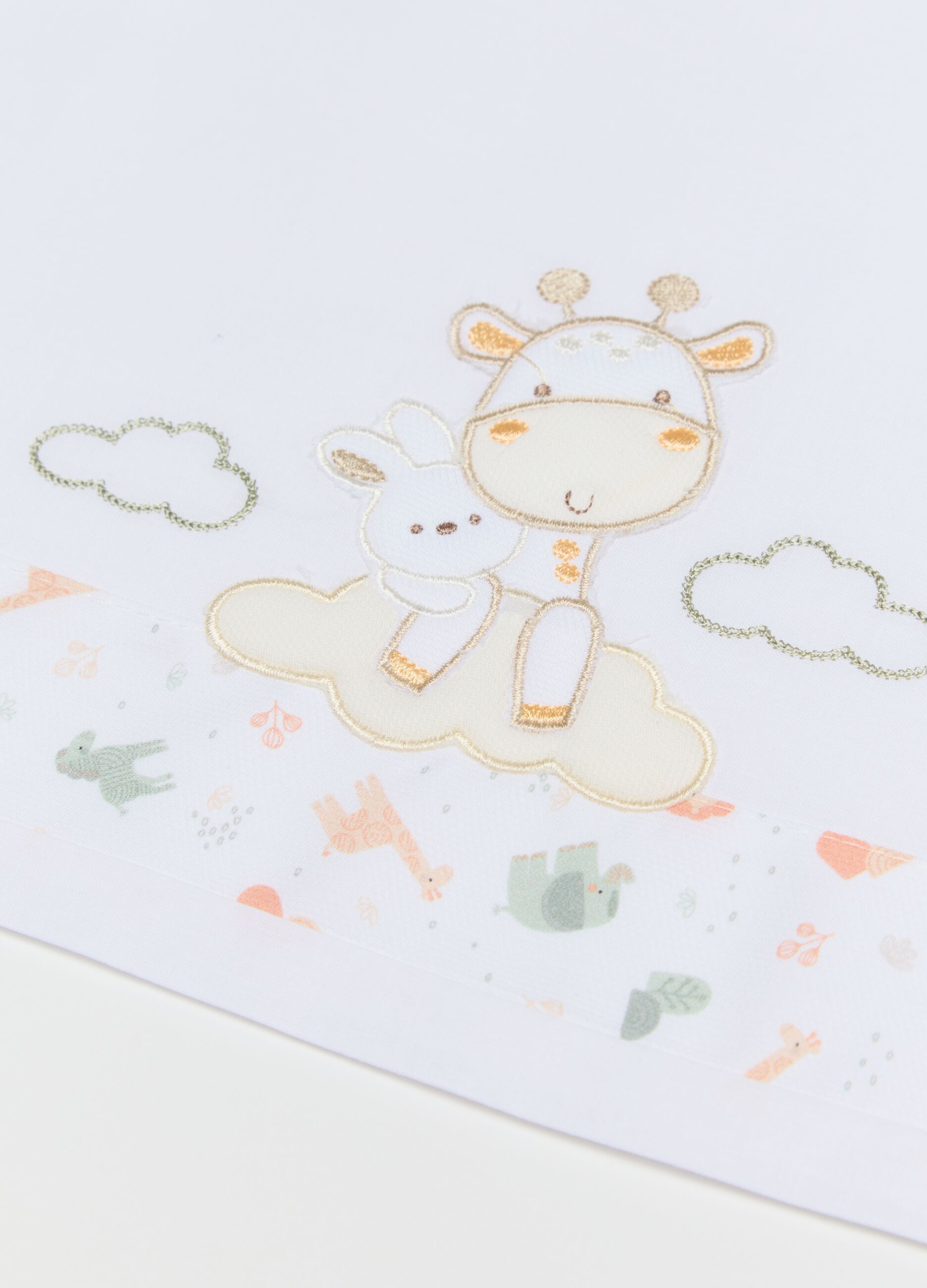 Three-piece white crib set with giraffe embroidery