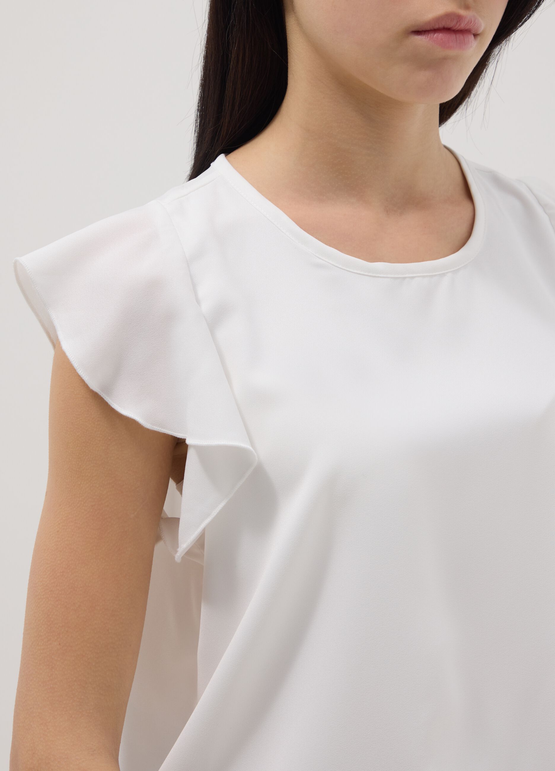 White regular fit girl's blouse with ruffled sleeves