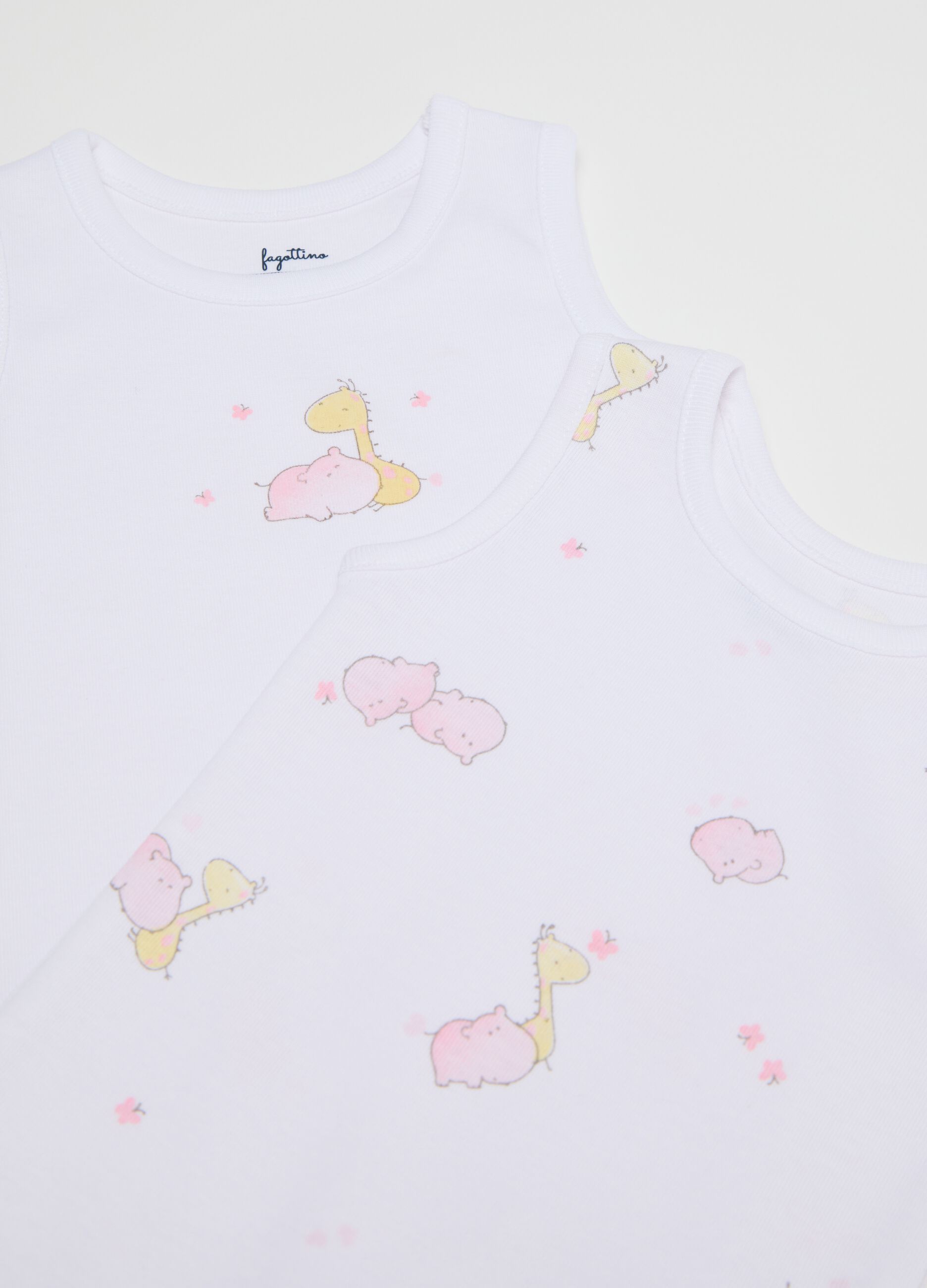 Three-pack white and pink sleeveless bodysuits in organic cotton with print