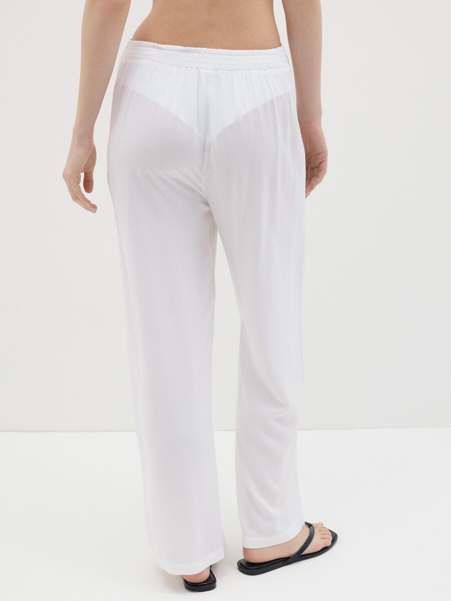 Long white beach cover-up trousers with drawstring_3