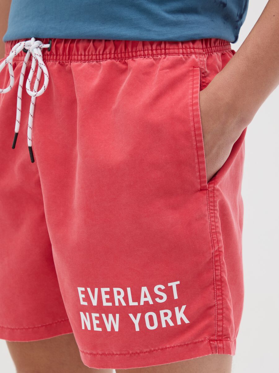 Red swimming trunks with logo print_2