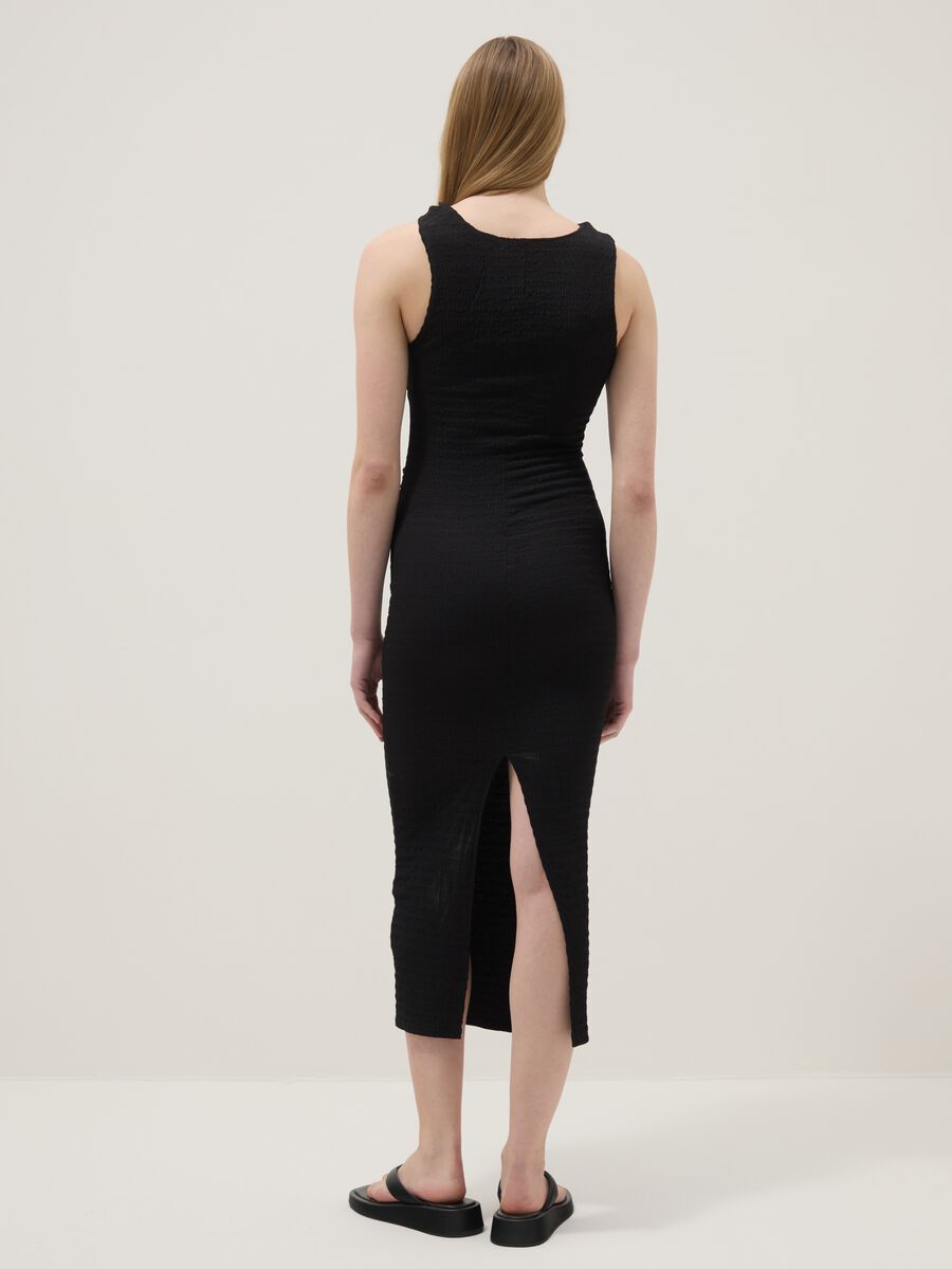 Black fitted sleeveless dress with back slit_3