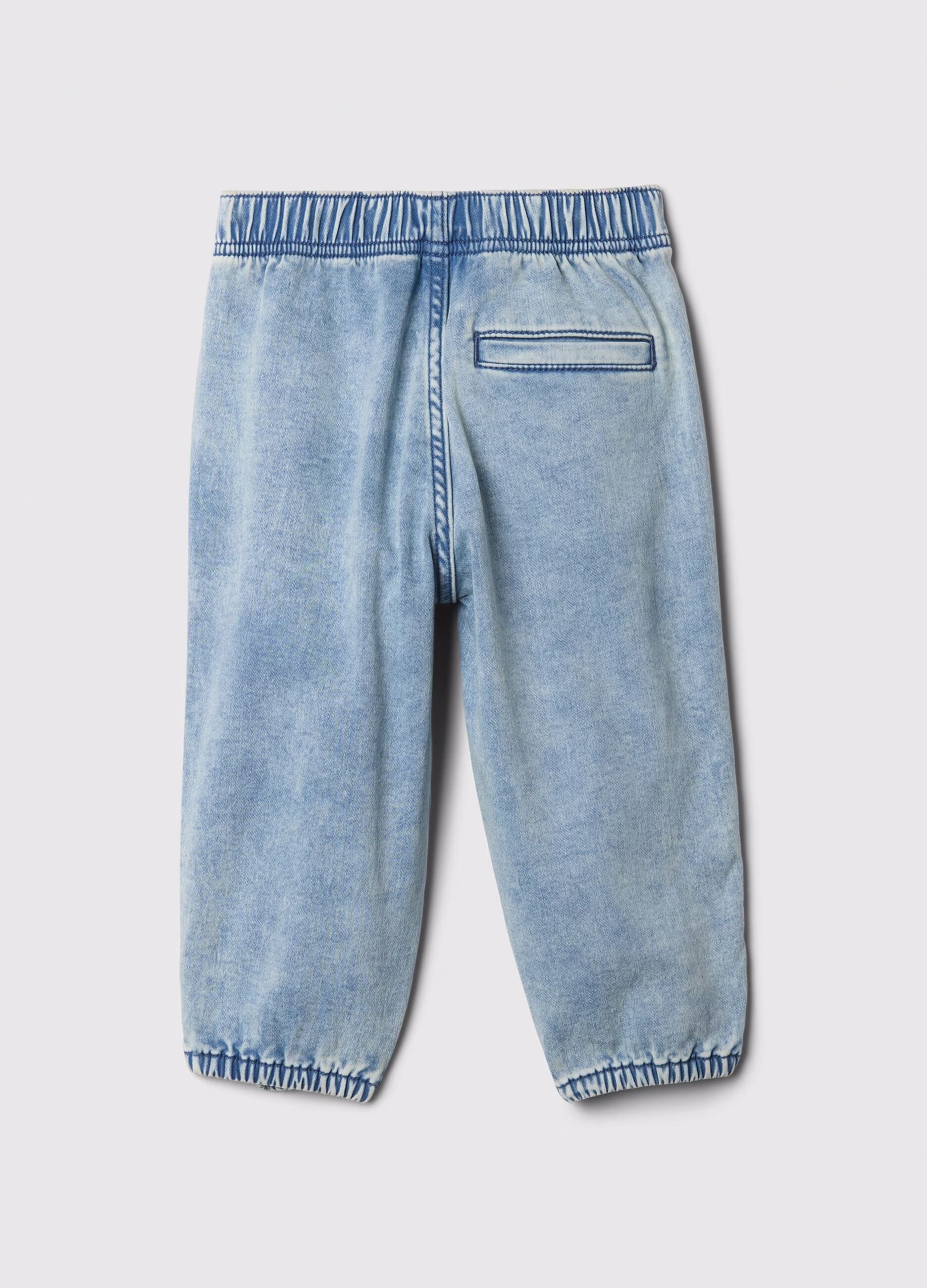 Pull-on denim jeans with acid wash effect