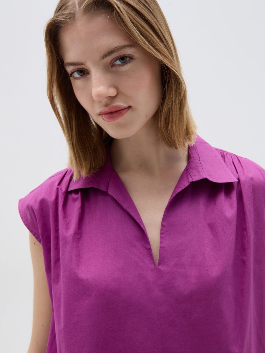 Sleeveless blouse with polo neck_1