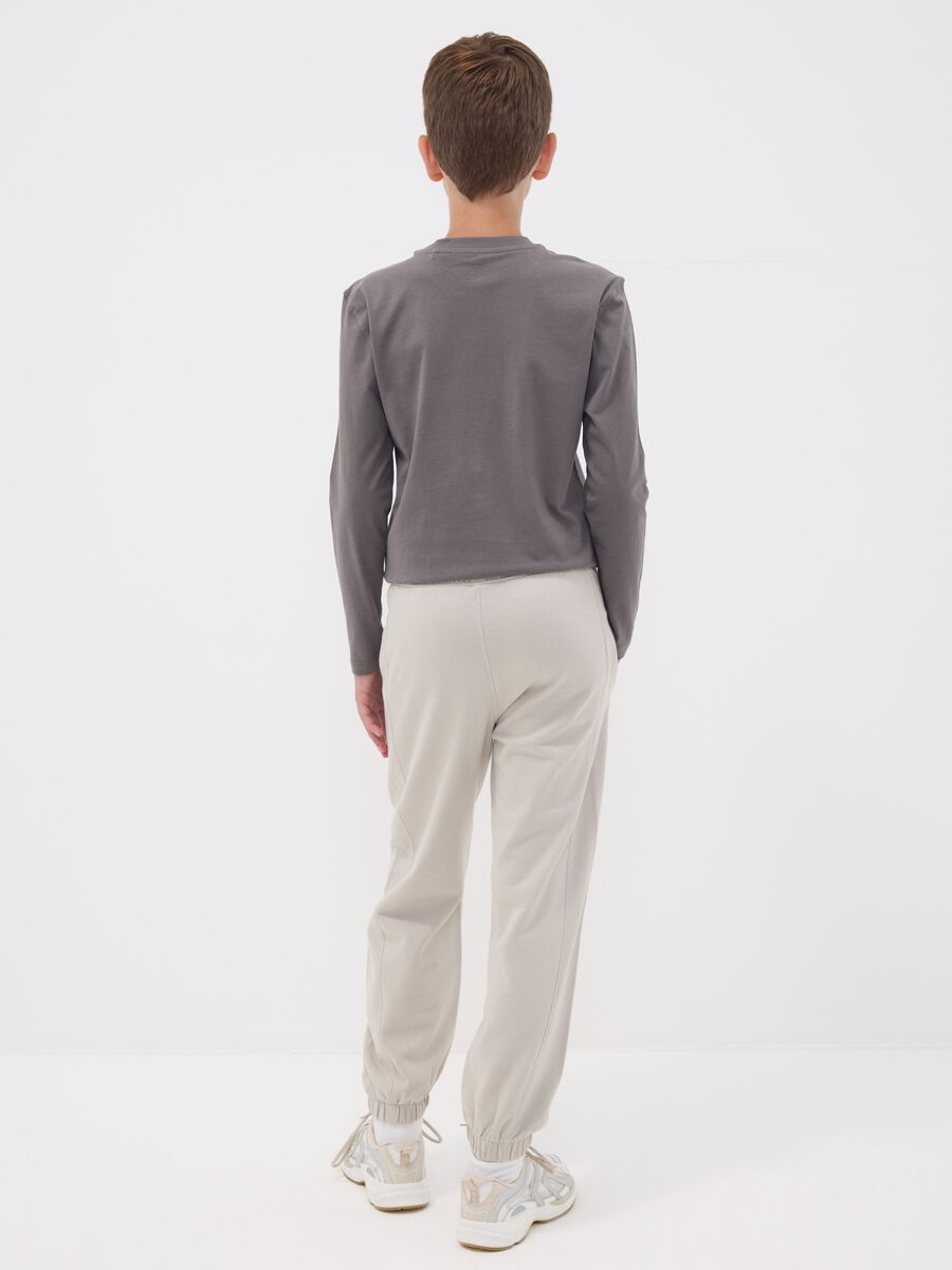 Pantaloni jogger grigi in puro cotone over fit per ragazzo_1