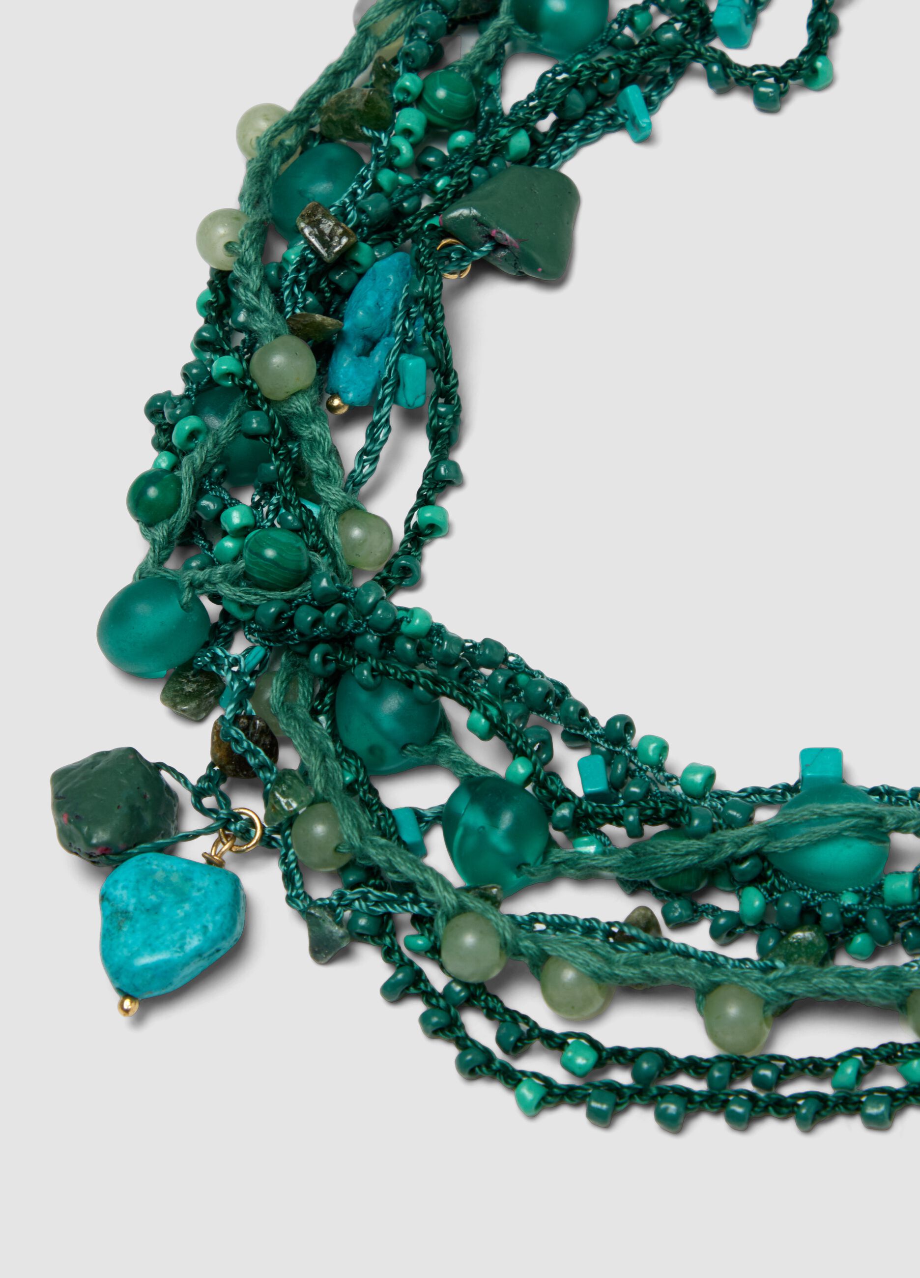 Green multi-strand necklace with decorative stones