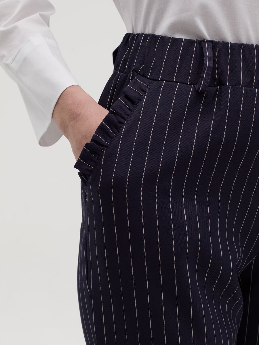 Cropped pinstriped trousers with frills_2