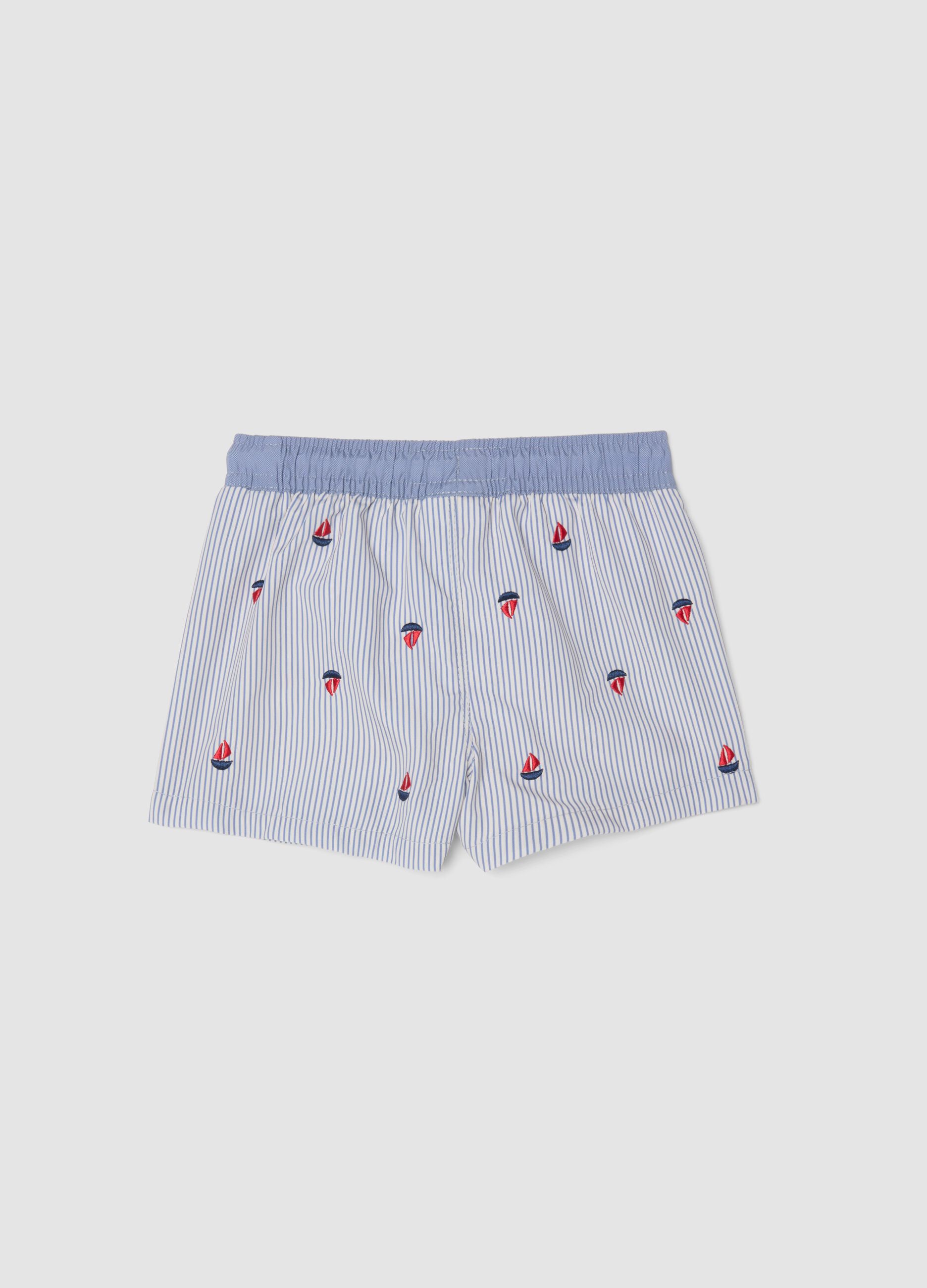 Blue striped baby swim shorts with embroidered boats