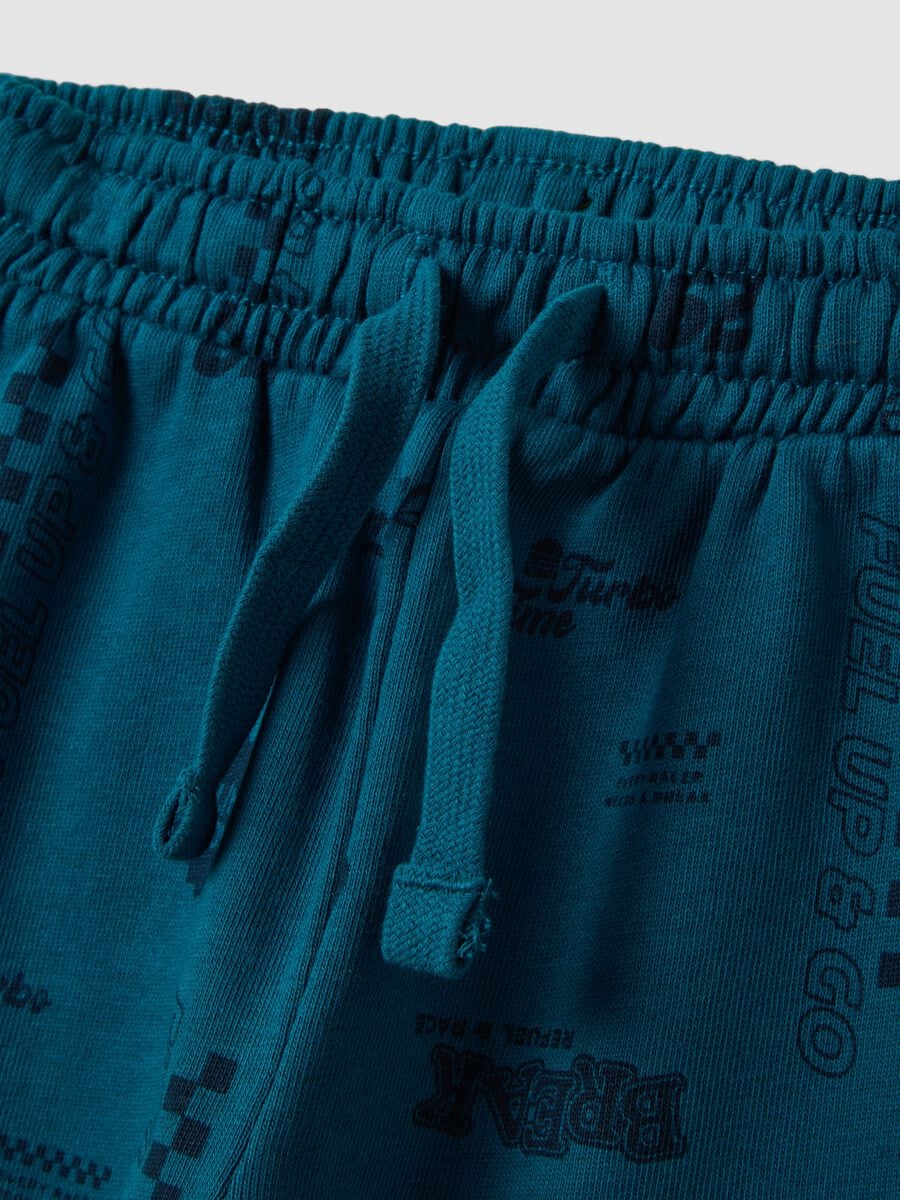 Pantaloni jogger blu in puro cotone con stampa all over_2