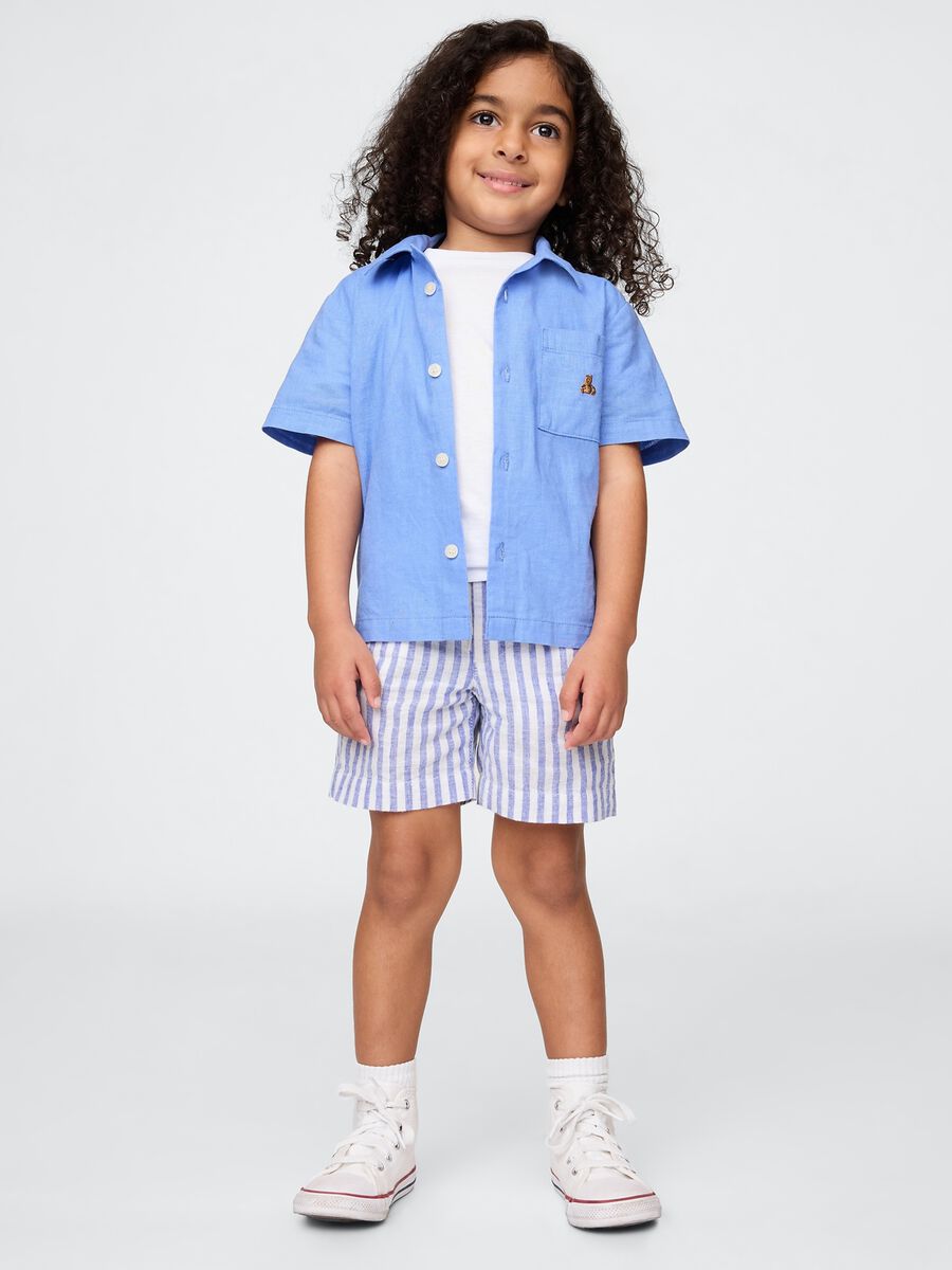 Blue shirt and white and blue striped shorts set_0