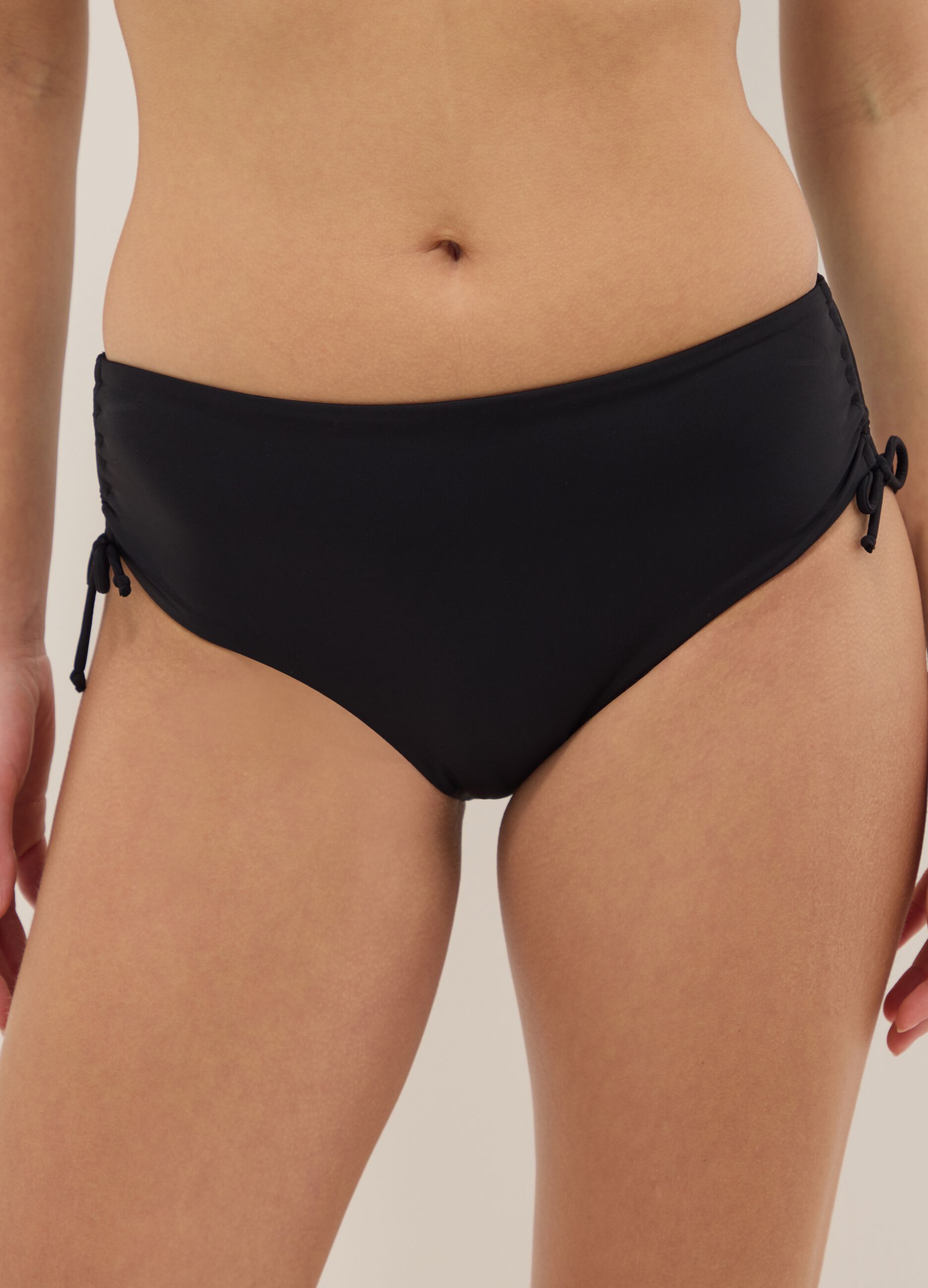 Black stretch bikini bottoms with ruched detailing