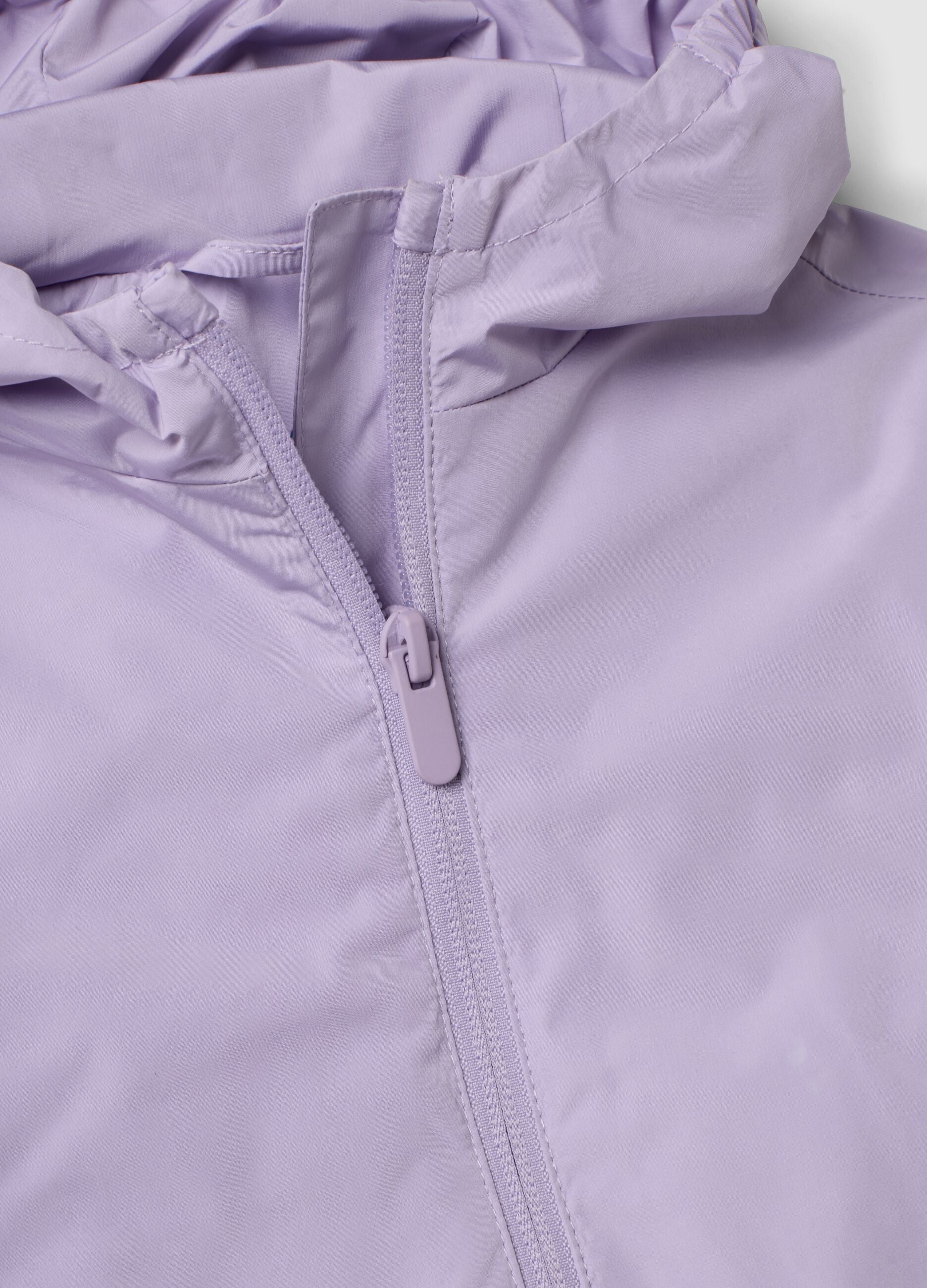 Giacca antipioggia viola con cappuccio e zip per bimba
