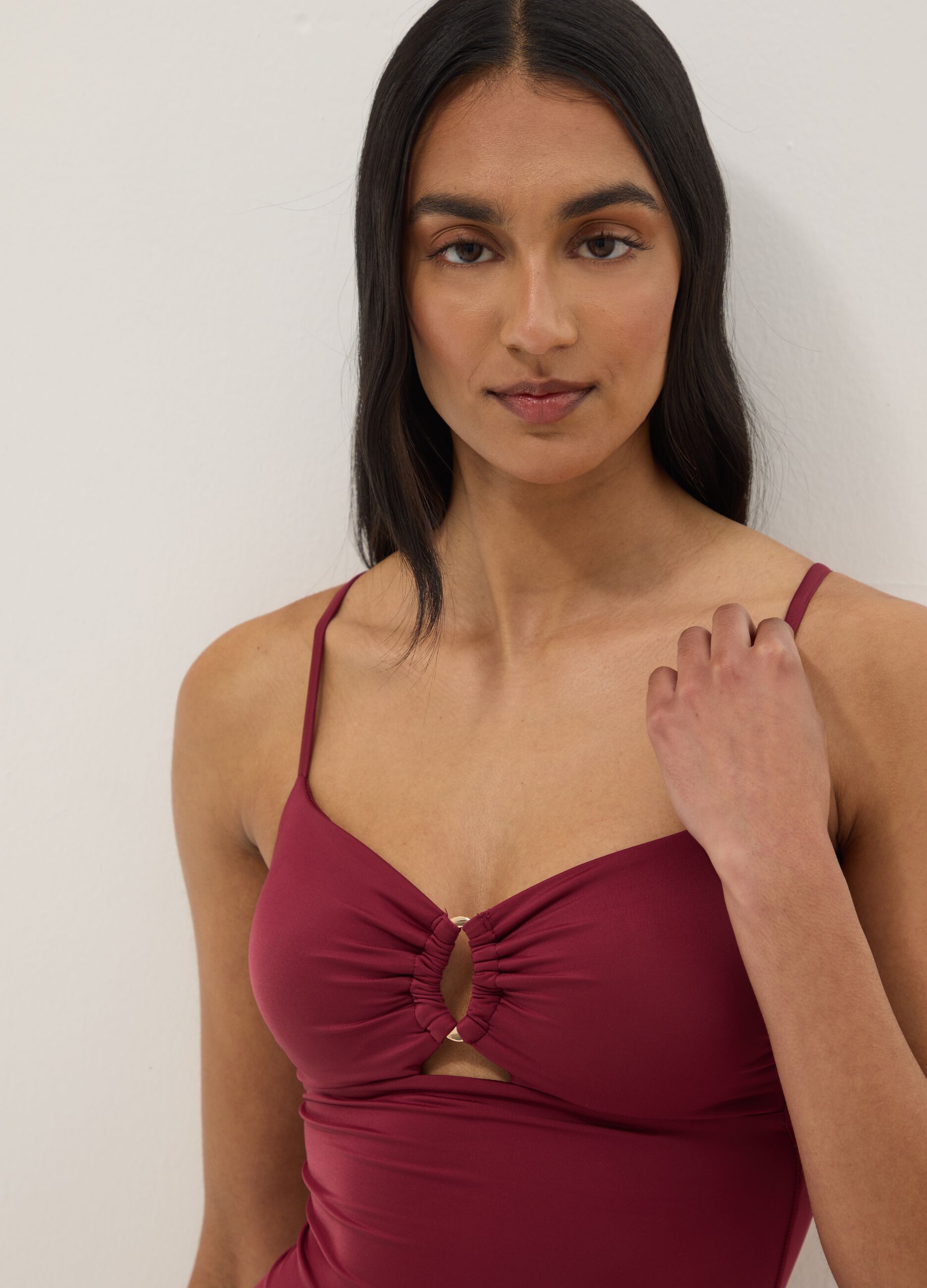 Red stretchy one-piece swimsuit with straps