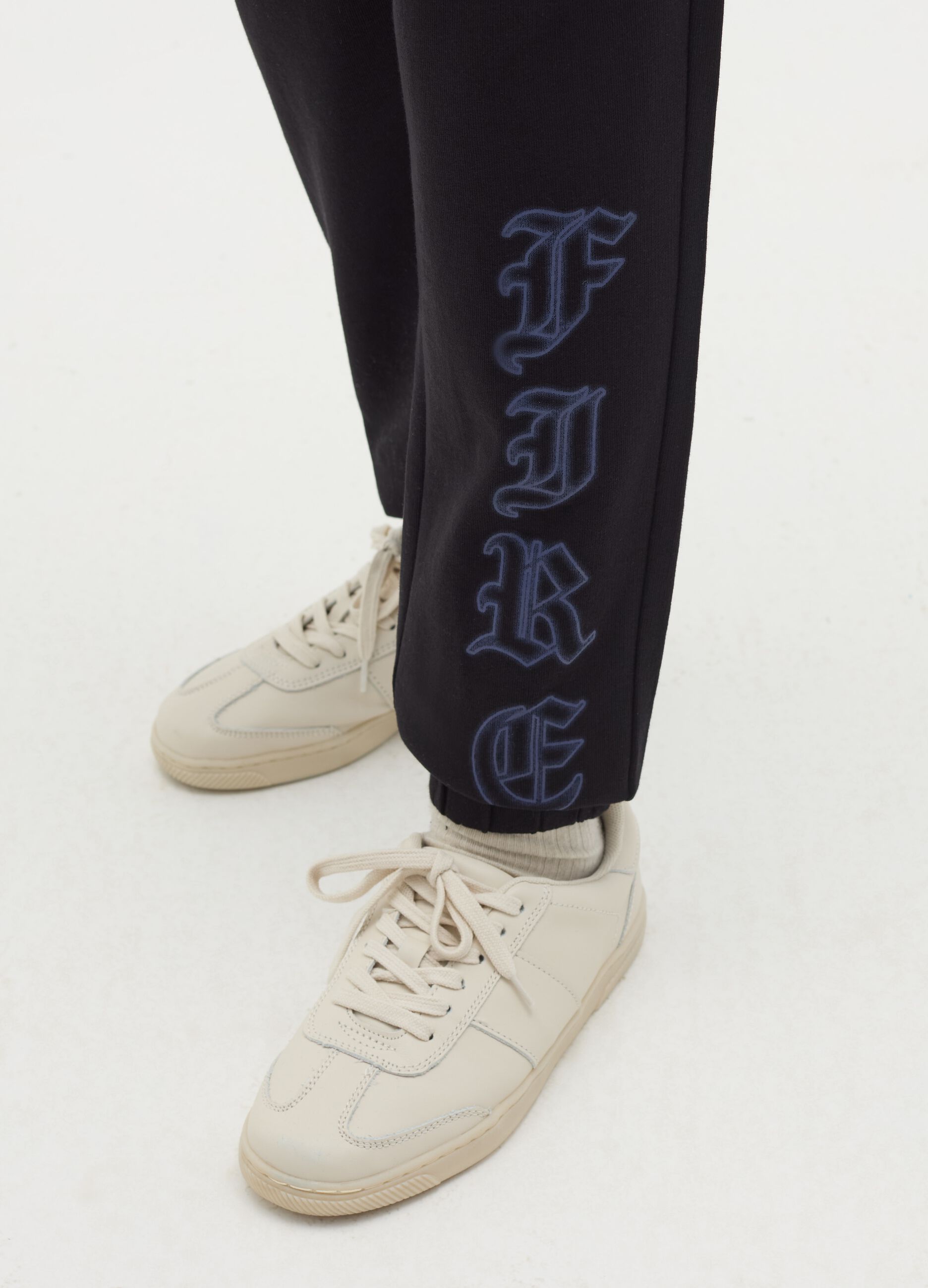 Joggers with drawstring and "Fire" print