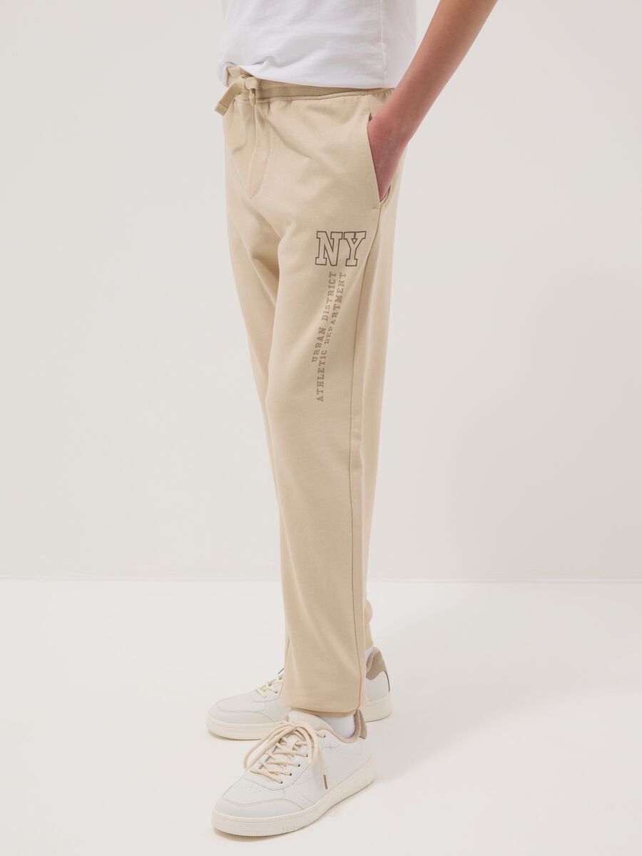 Jogger in puro cotone beige da ragazzo regular fit_1
