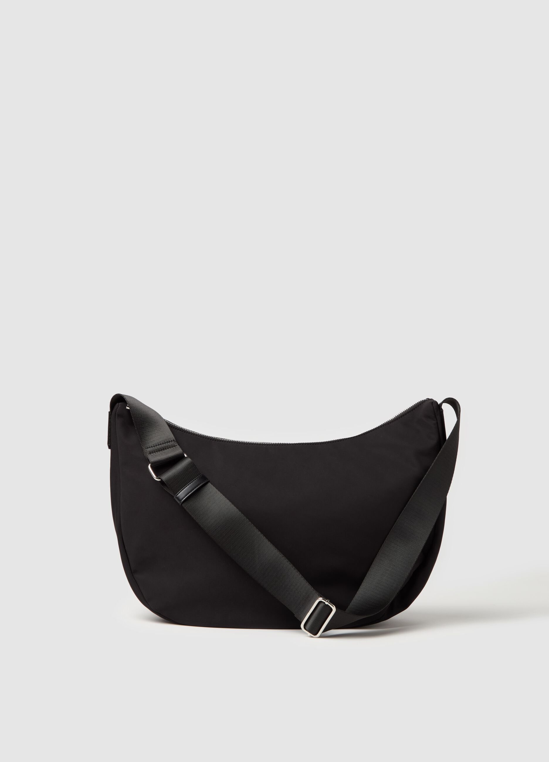 Contemporary half-moon bag with shoulder strap