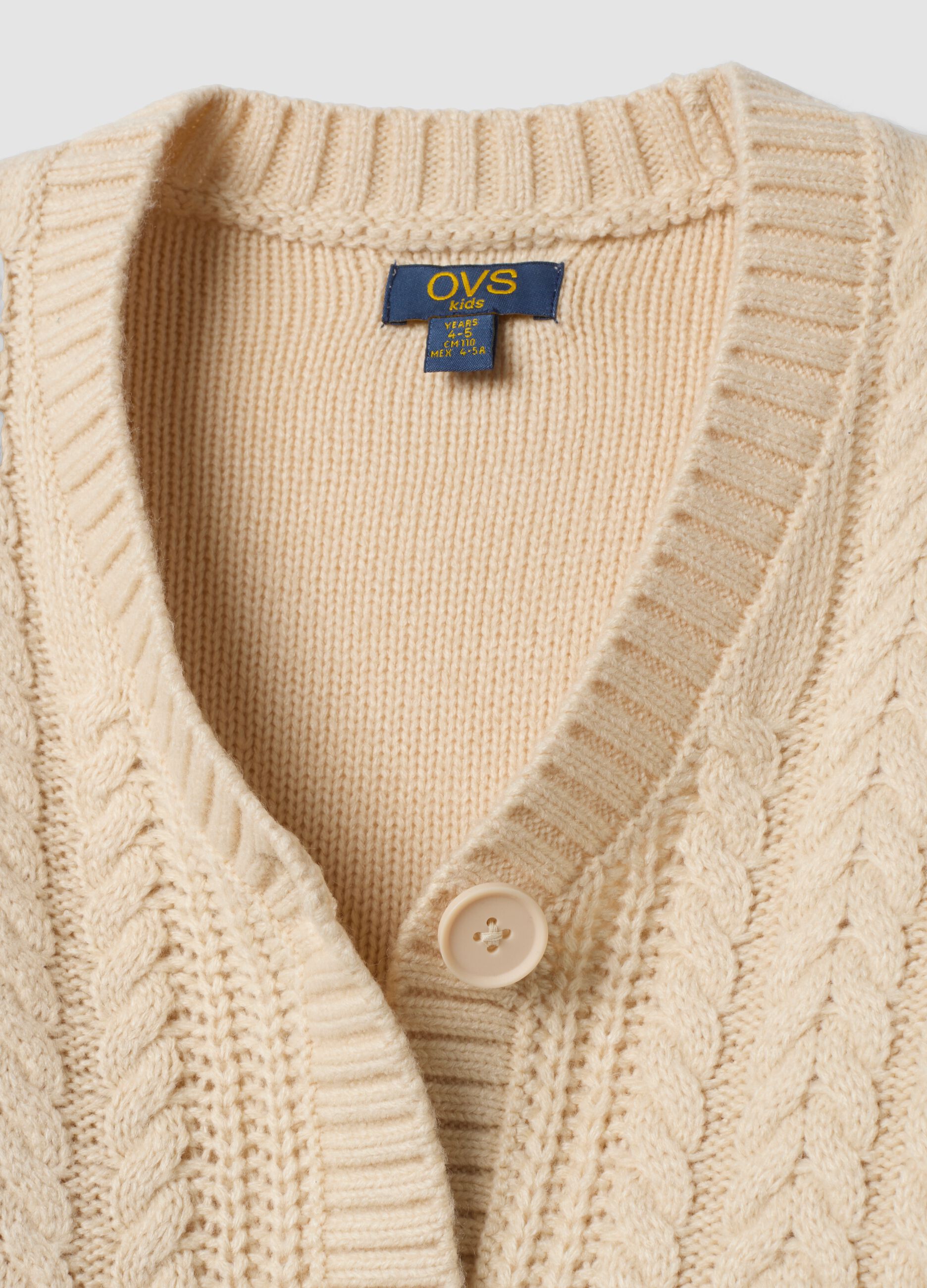 Cardigan beige in maglia con scollo profondo a V