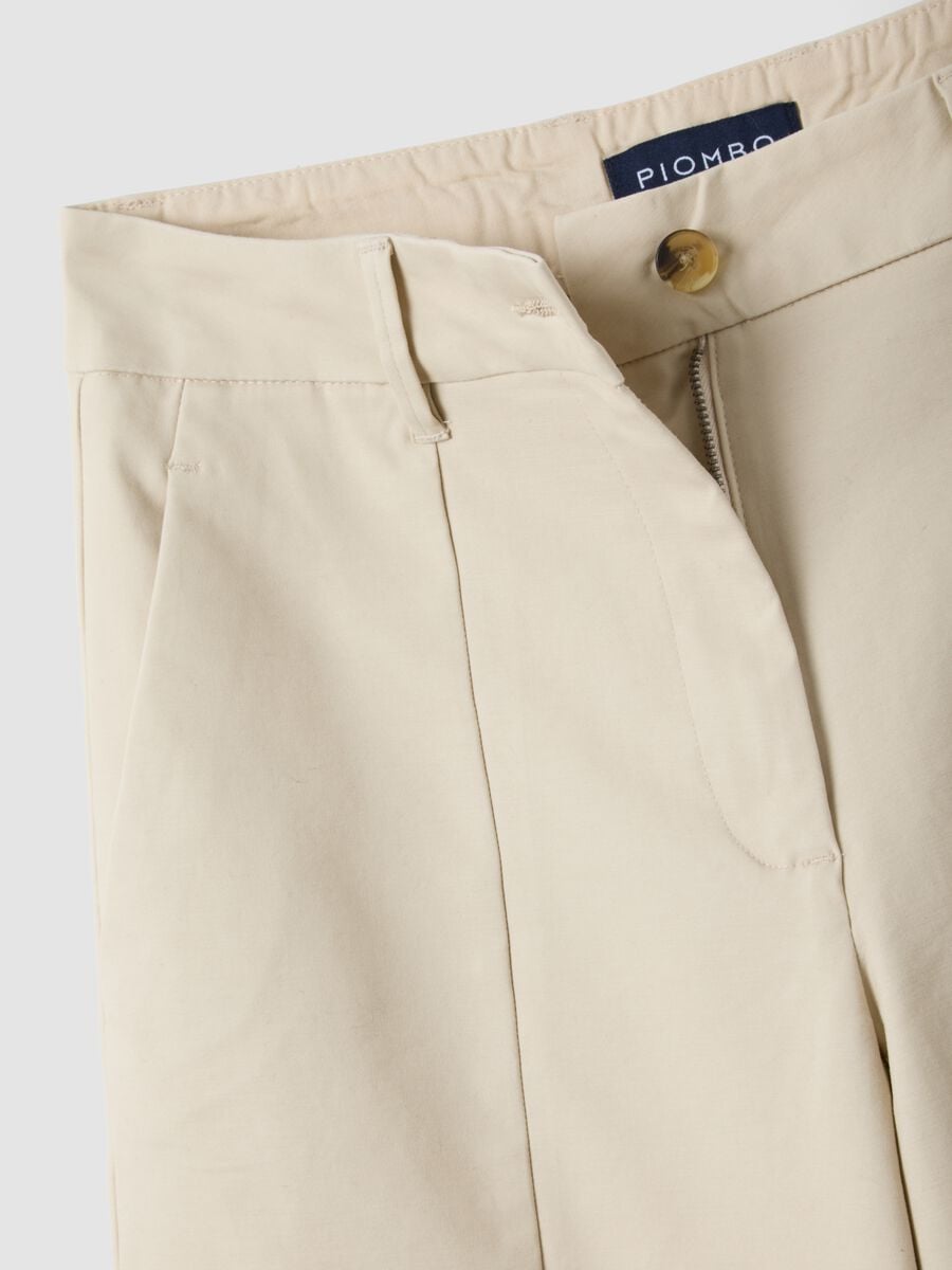 Beige flared stretch cotton trousers_1