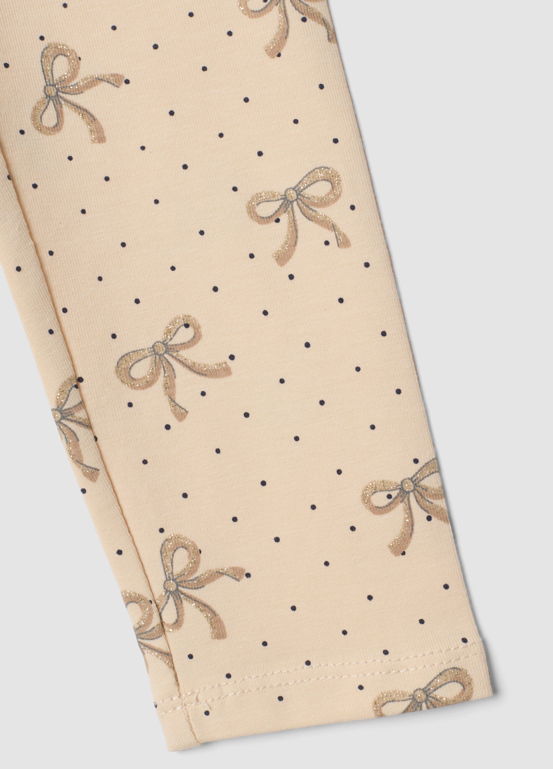 Leggings skinny beige in cotone organico elasticizzato con fiocchi per bambina