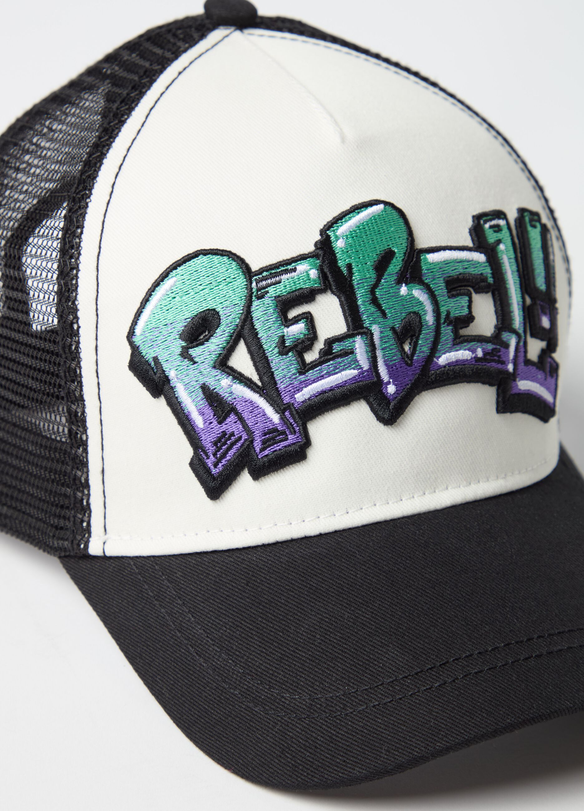 Baseball cap with "REBEL!" patch