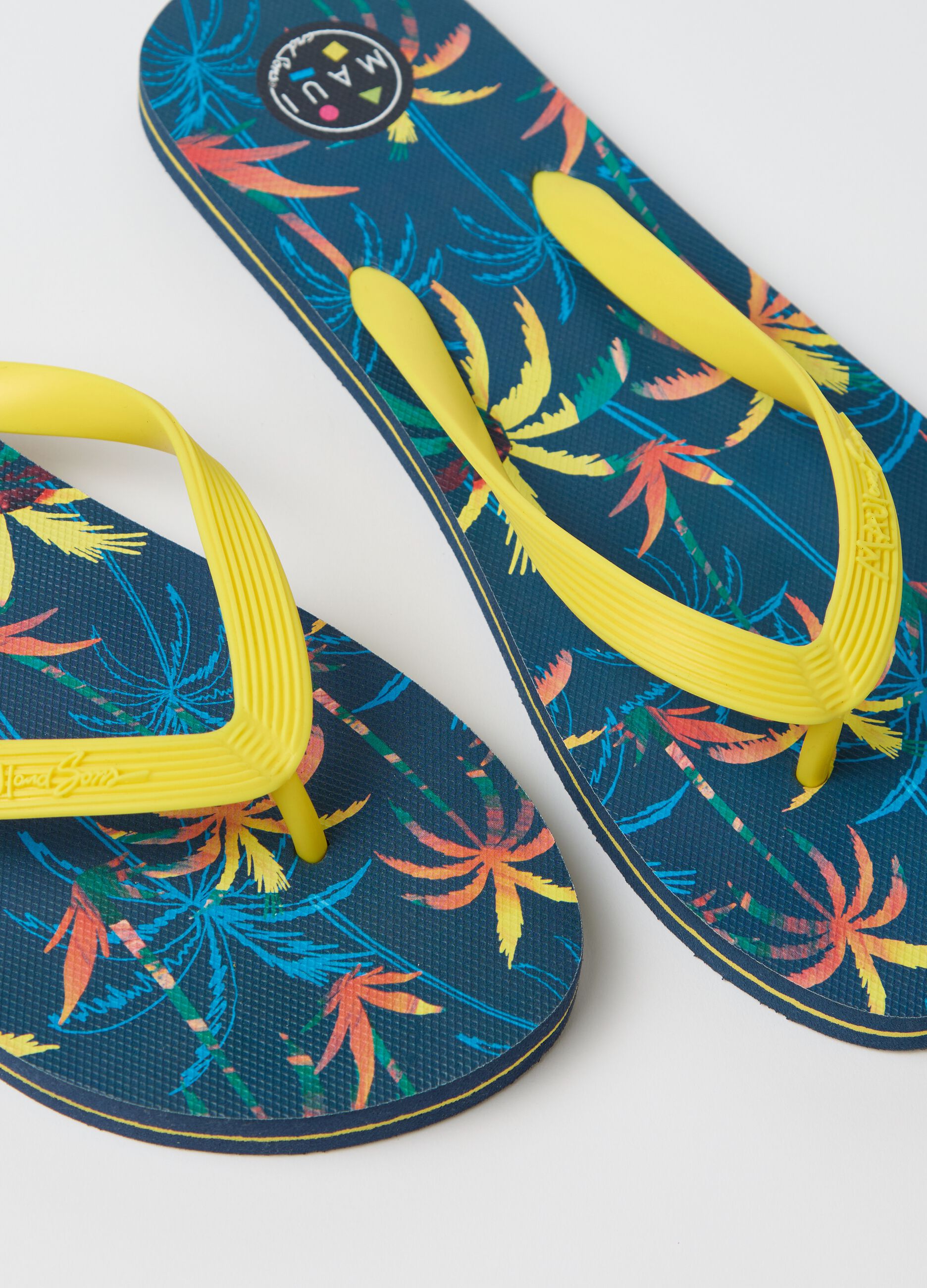 Maui and Sons blue flip flops with tropical print