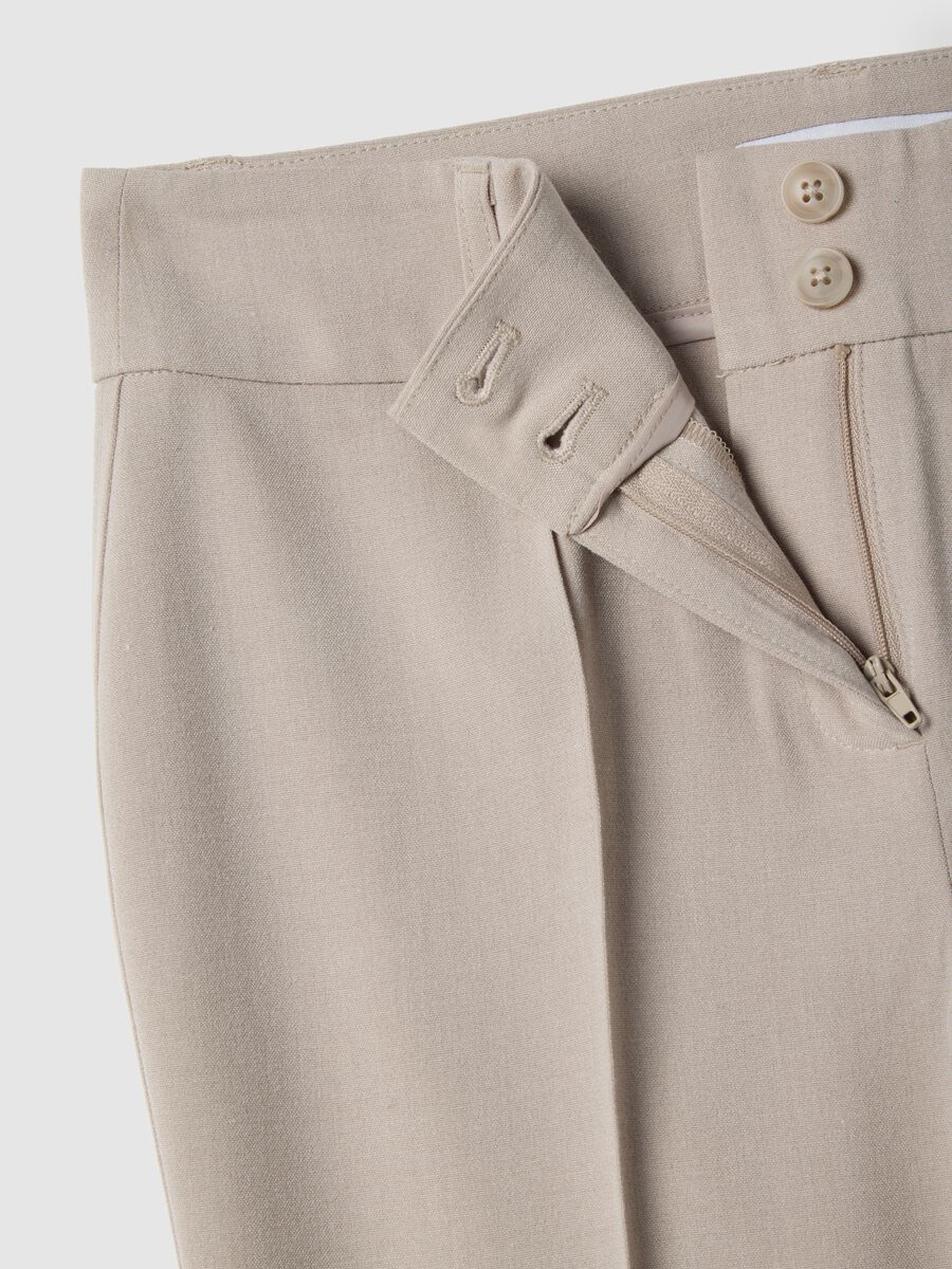 Beige stretch fabric flare fit trousers_1