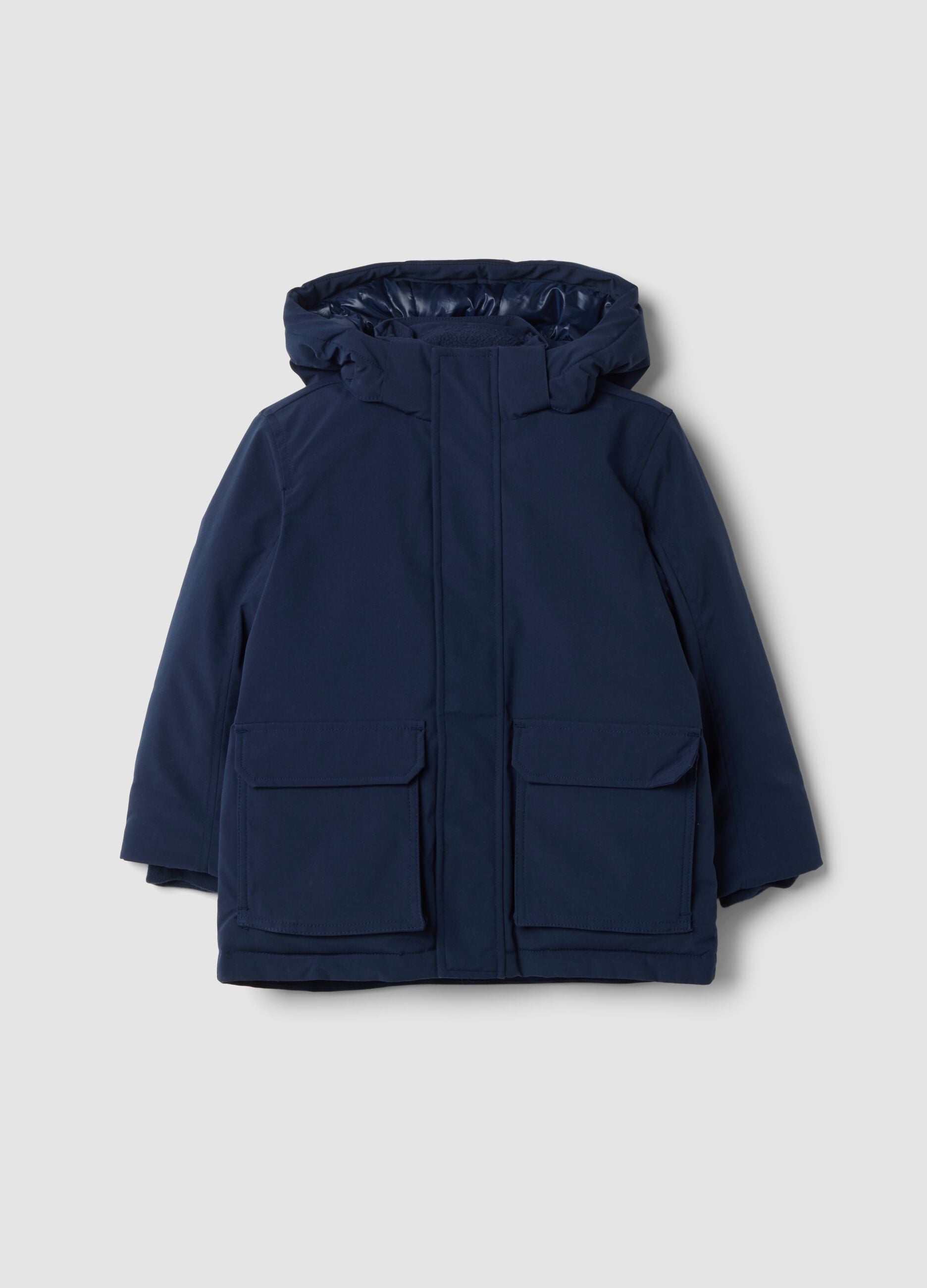 Long padded navy parka with detachable hood, oversized fit