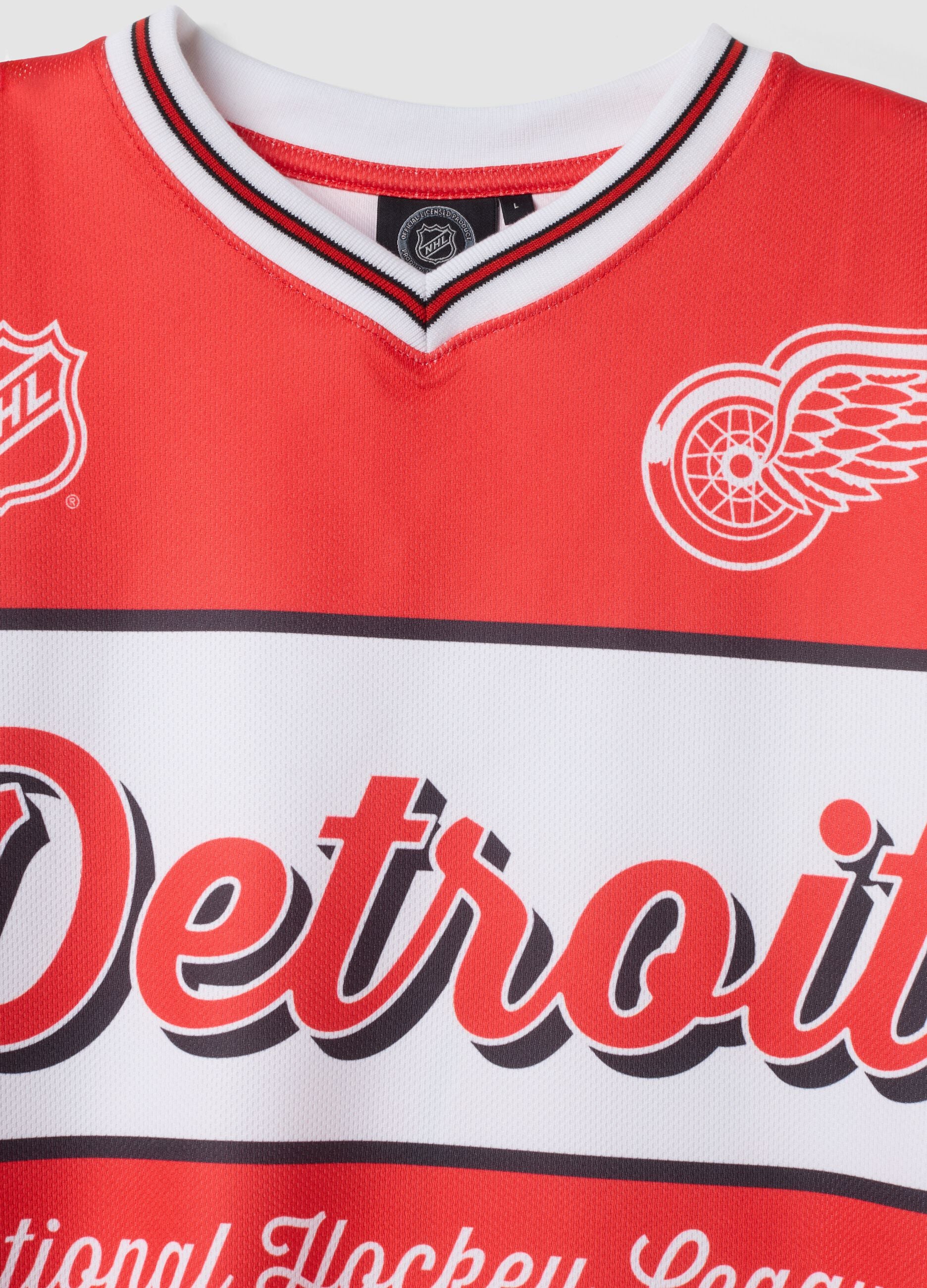 Red and white hockey-style T-shirt with Detroit Red Wings print
