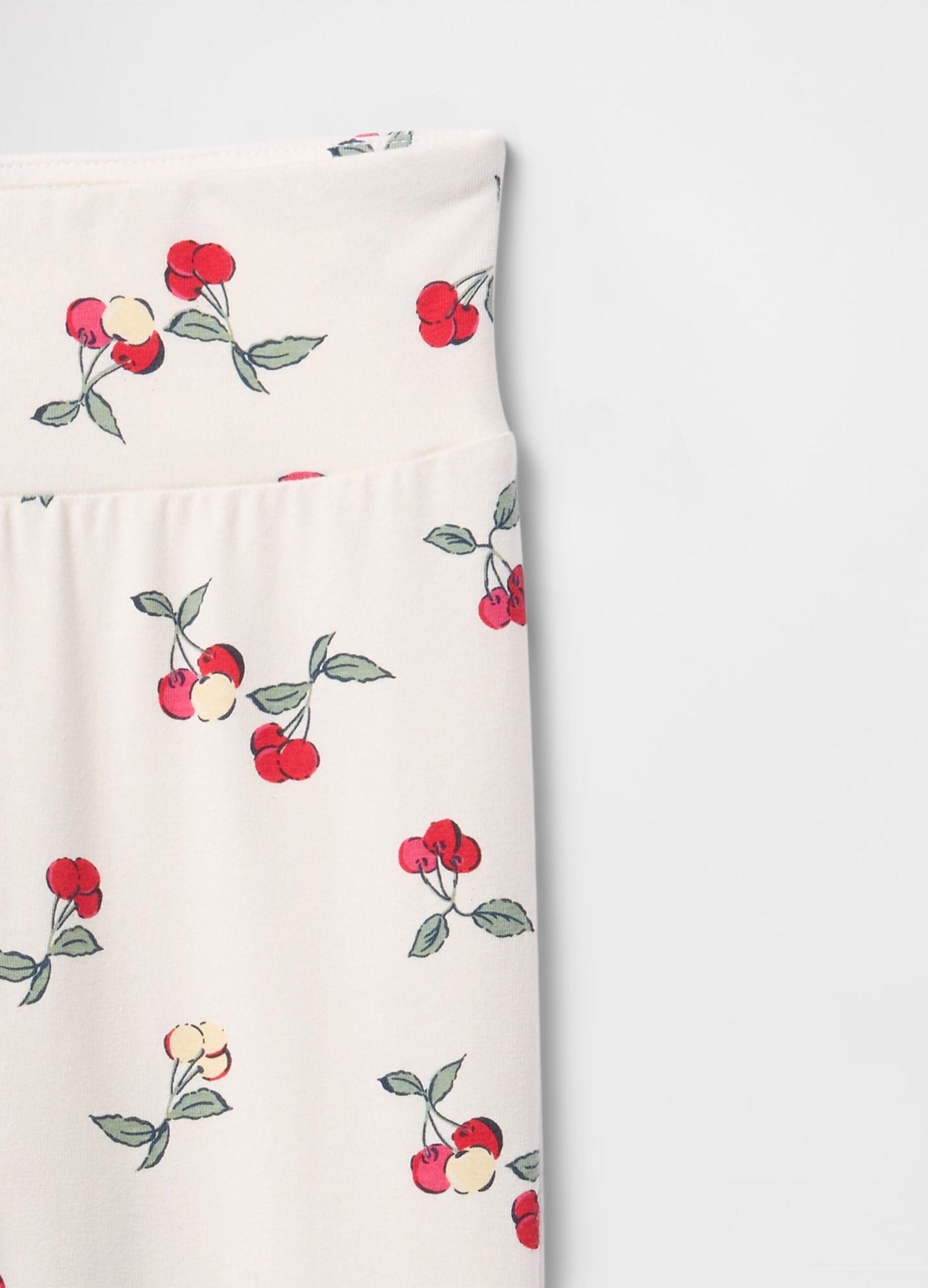 Flared trousers with floral pattern on white background