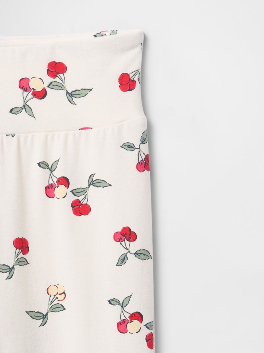 Flared trousers with floral pattern on white background_4