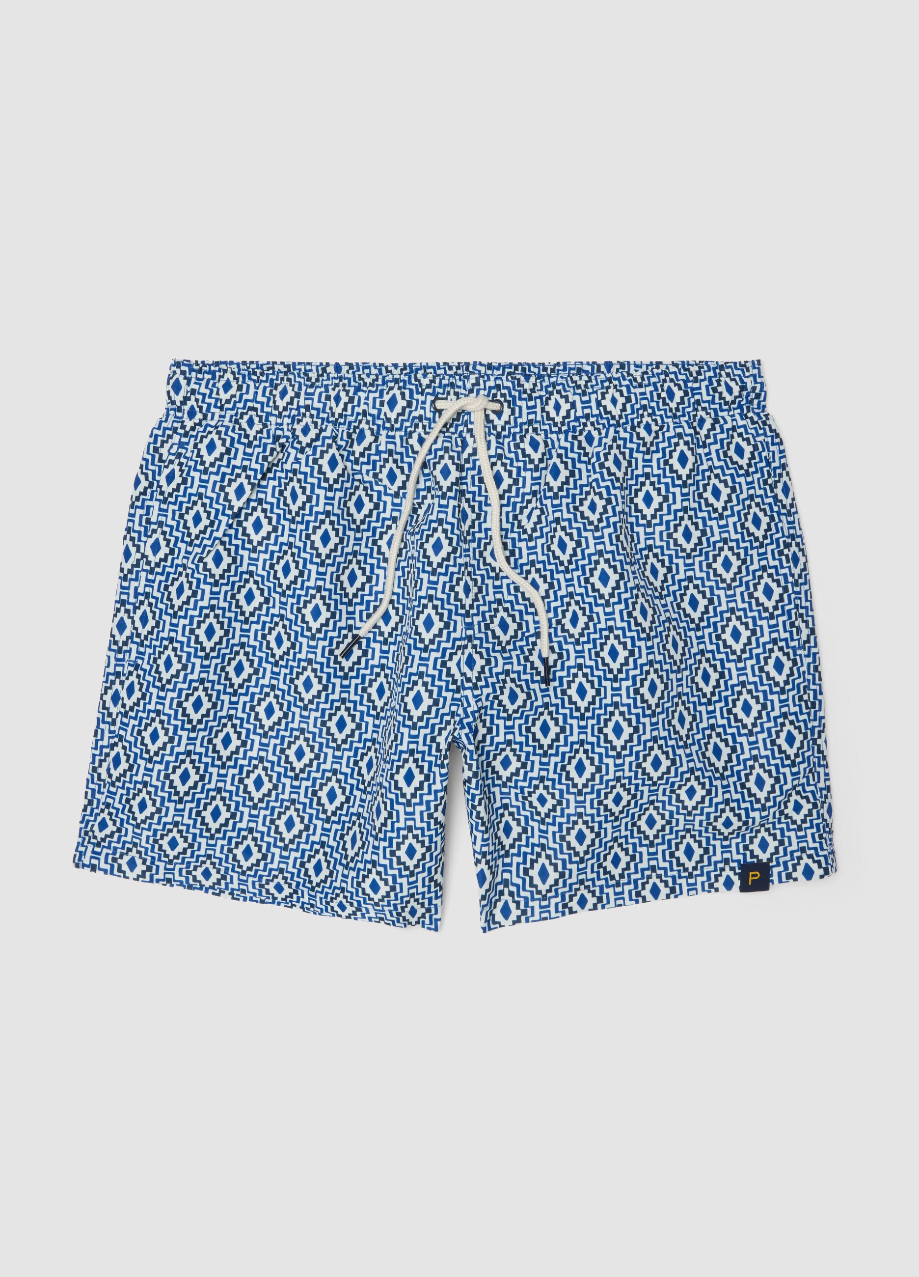 Blue swim shorts with geometric print