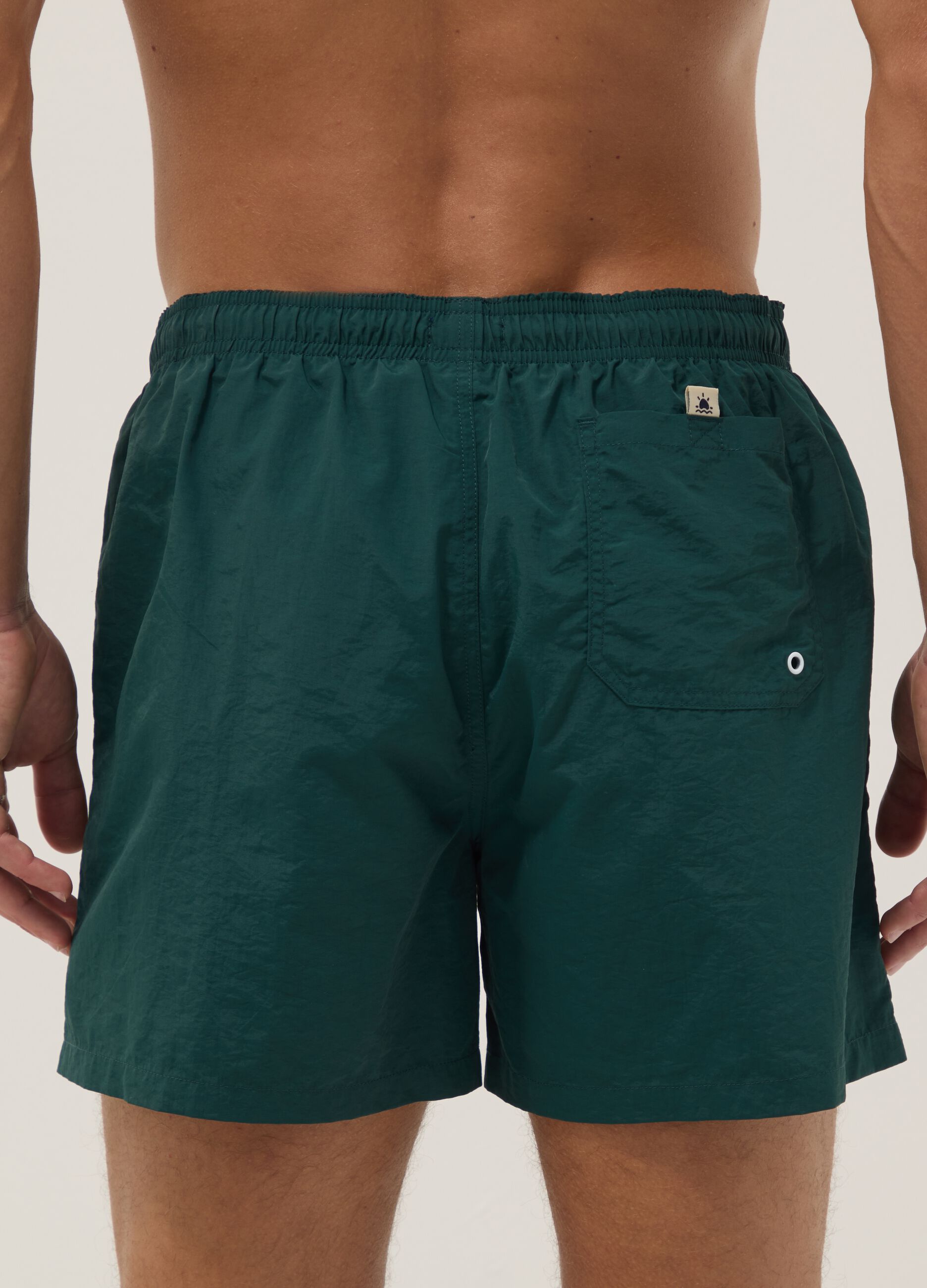 Green swim shorts with elasticated waistband