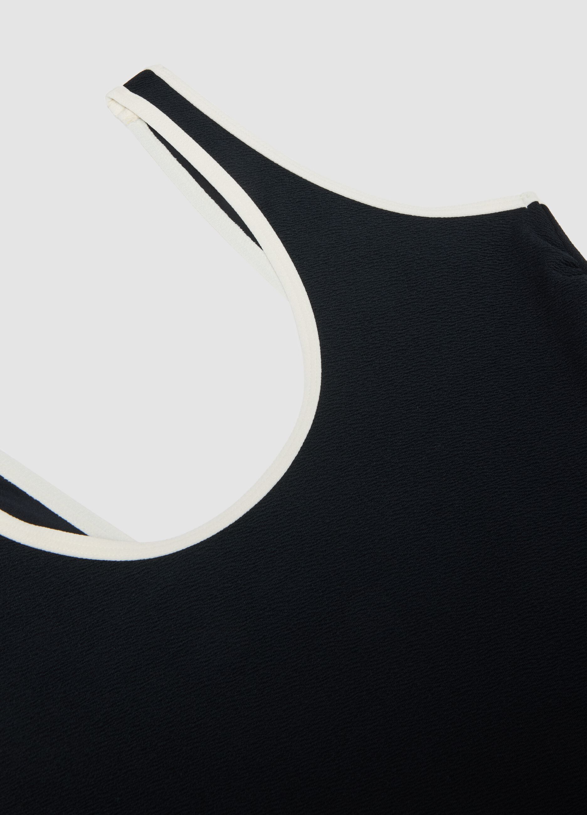 Black stretch one-piece swimsuit with white trim