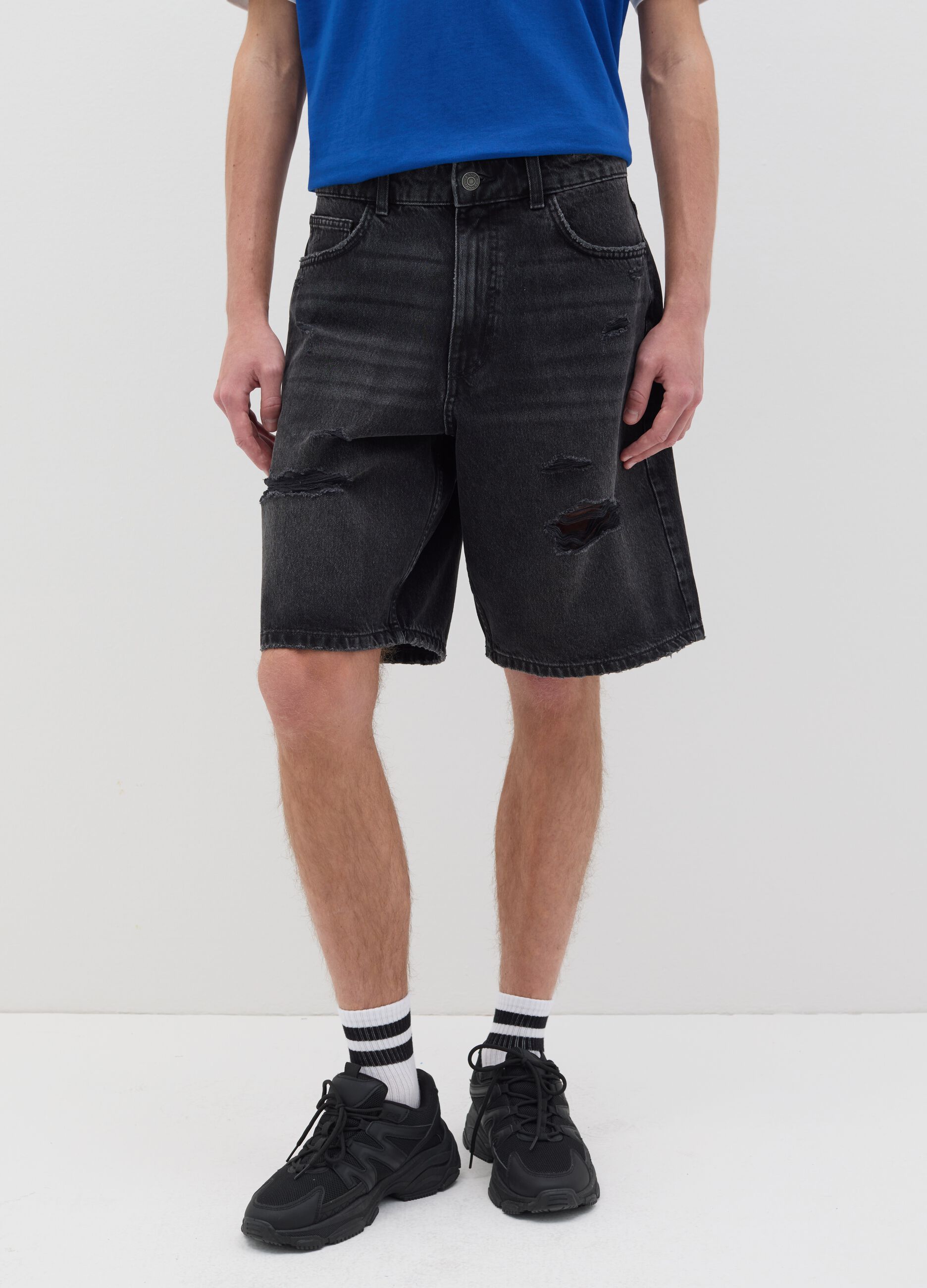 Black denim shorts with ripped details