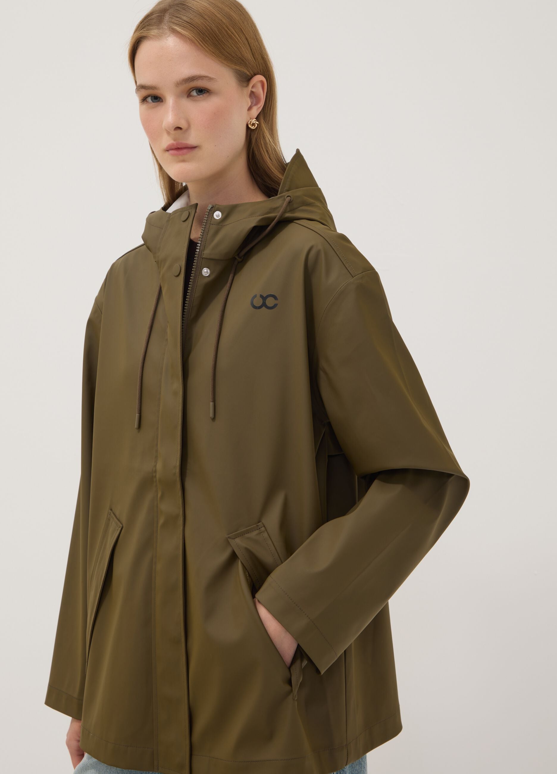 Green rain jacket with zip and hood