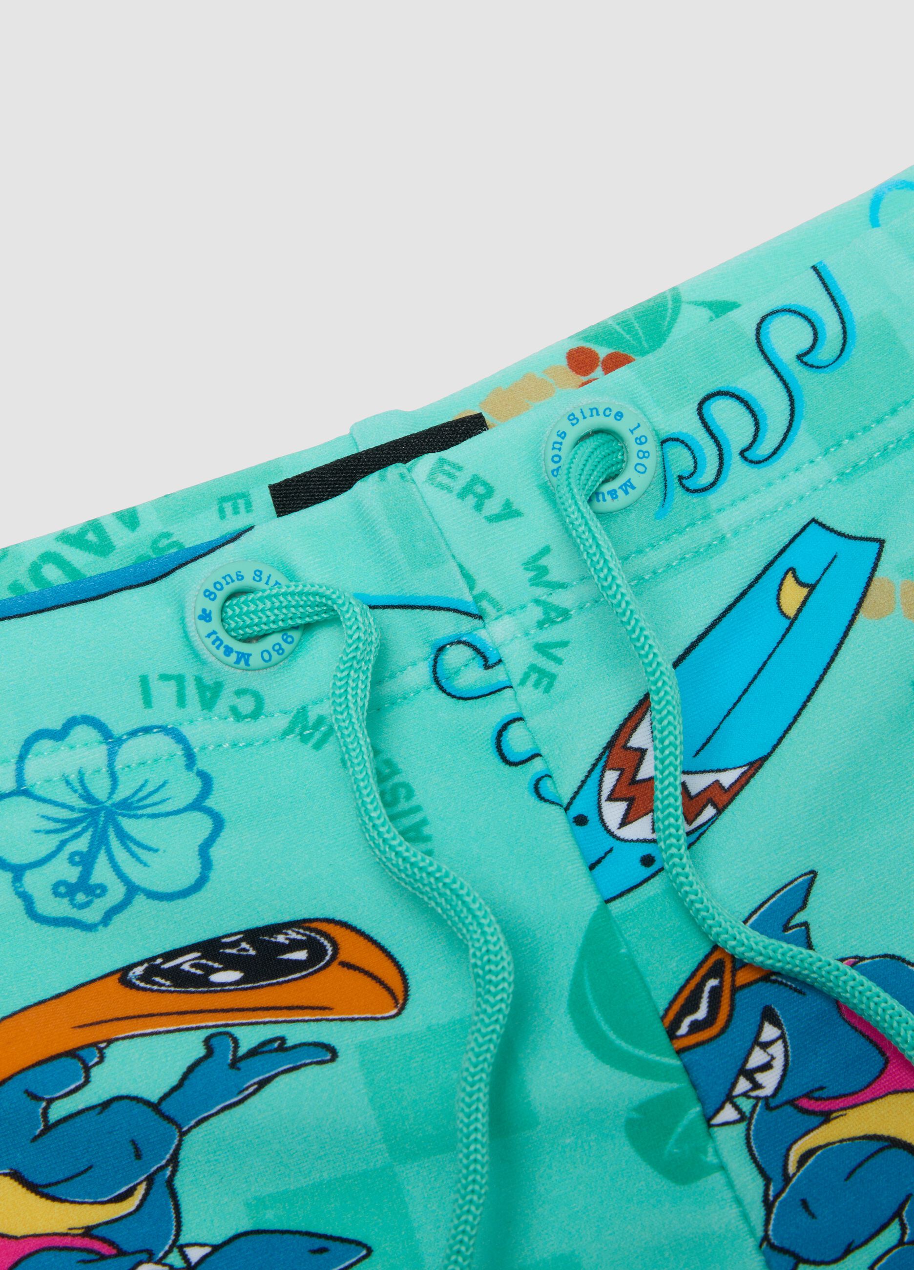 Boys&rsquo; blue stretch swim shorts with print