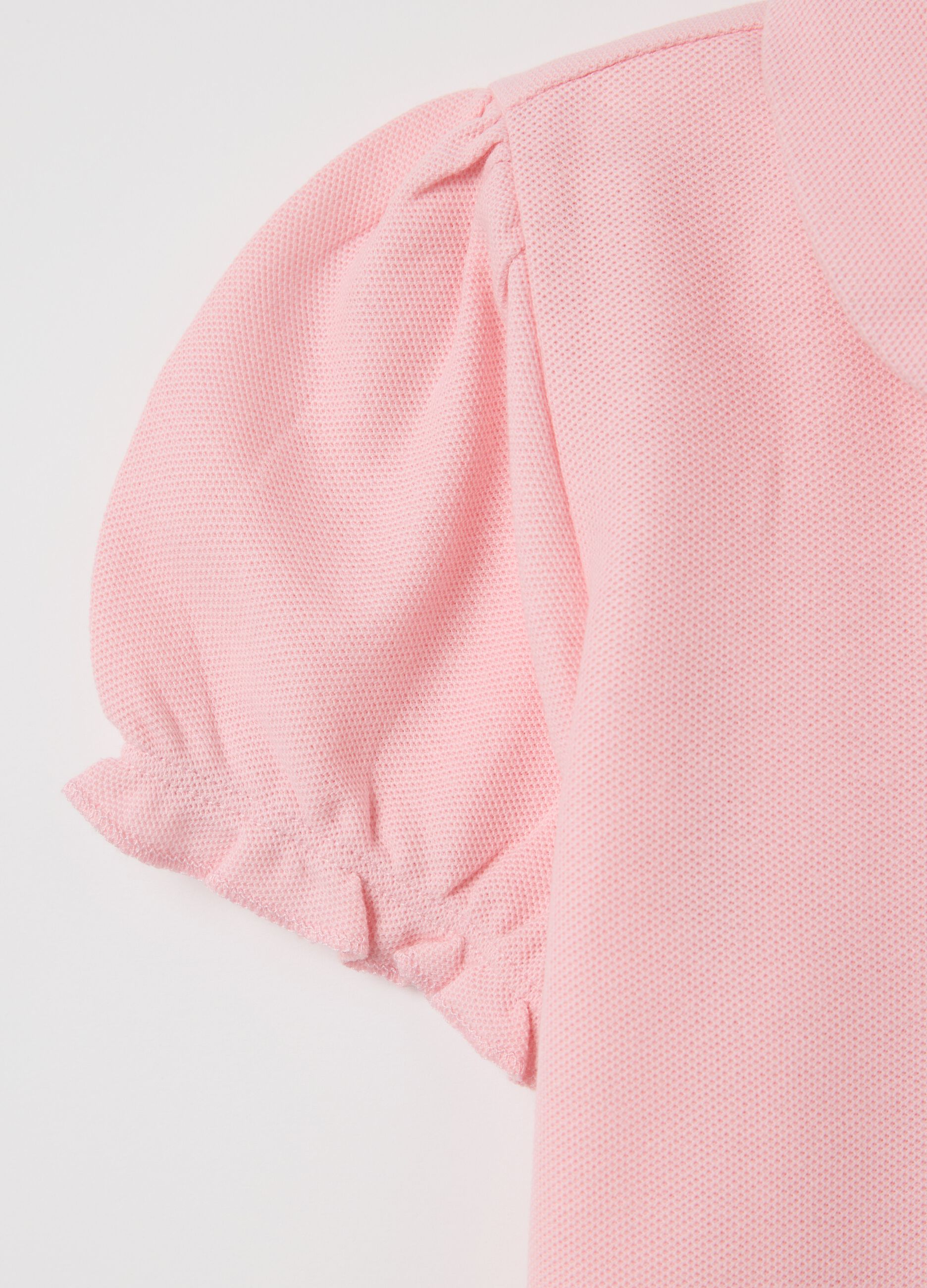 Pink polo shirt with short sleeves and star
