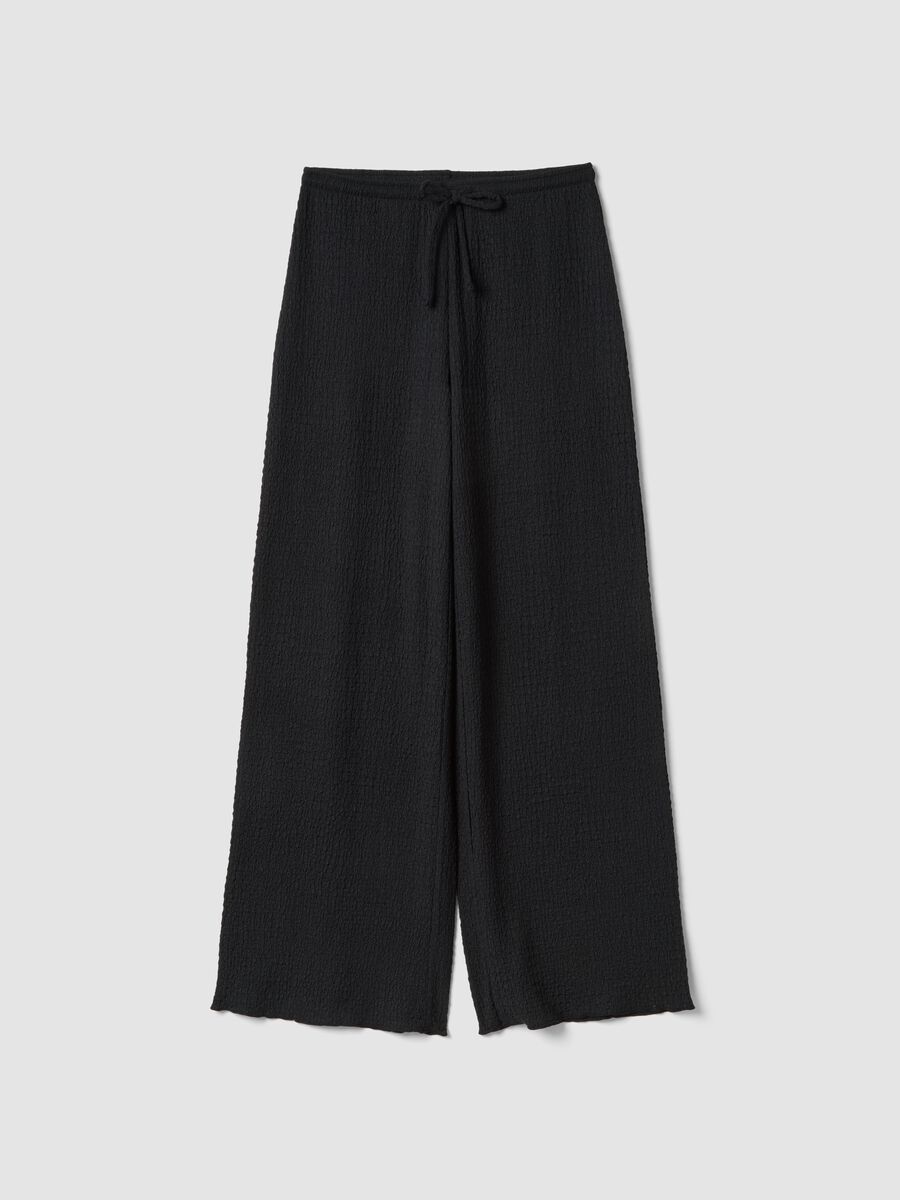 Black stretchy wide-leg trousers with crinkled texture_0