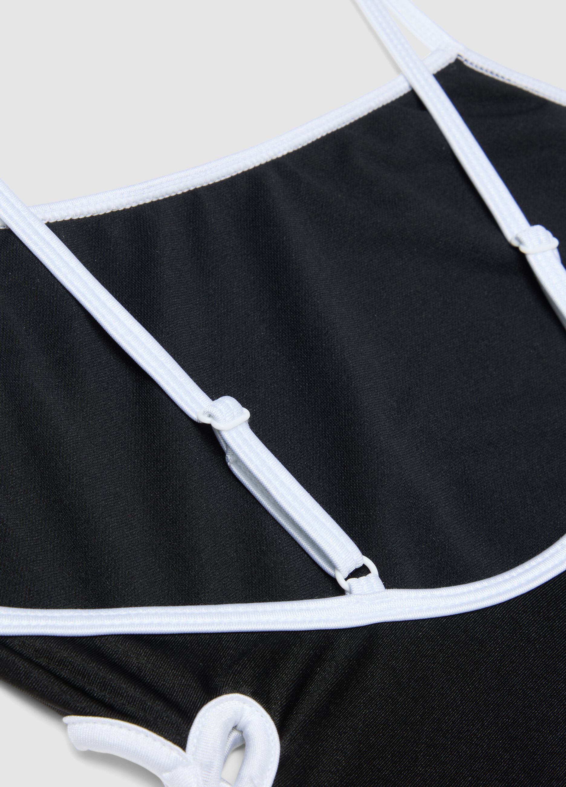 Black stretch one-piece swimsuit with contrasting trim