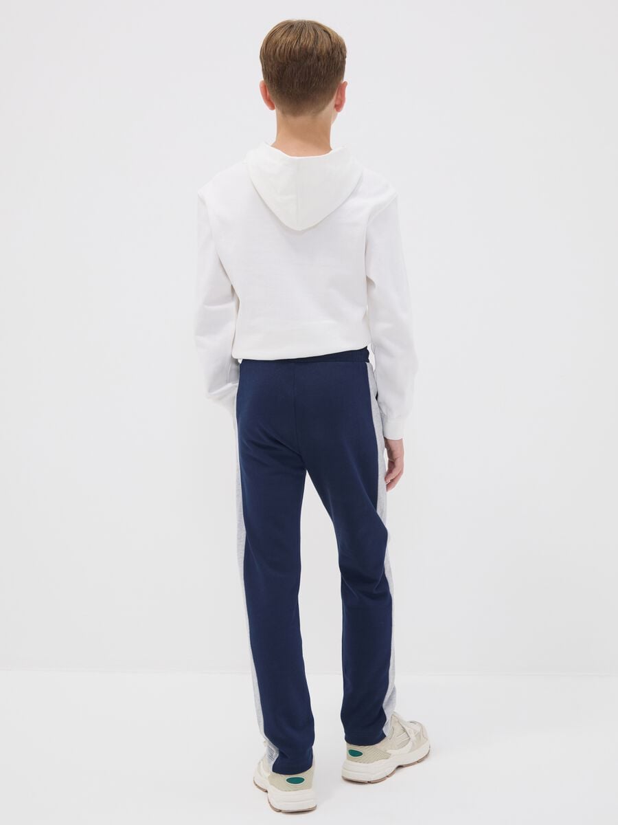 Pantaloni jogger blu in puro cotone con bande laterali per ragazzo_1