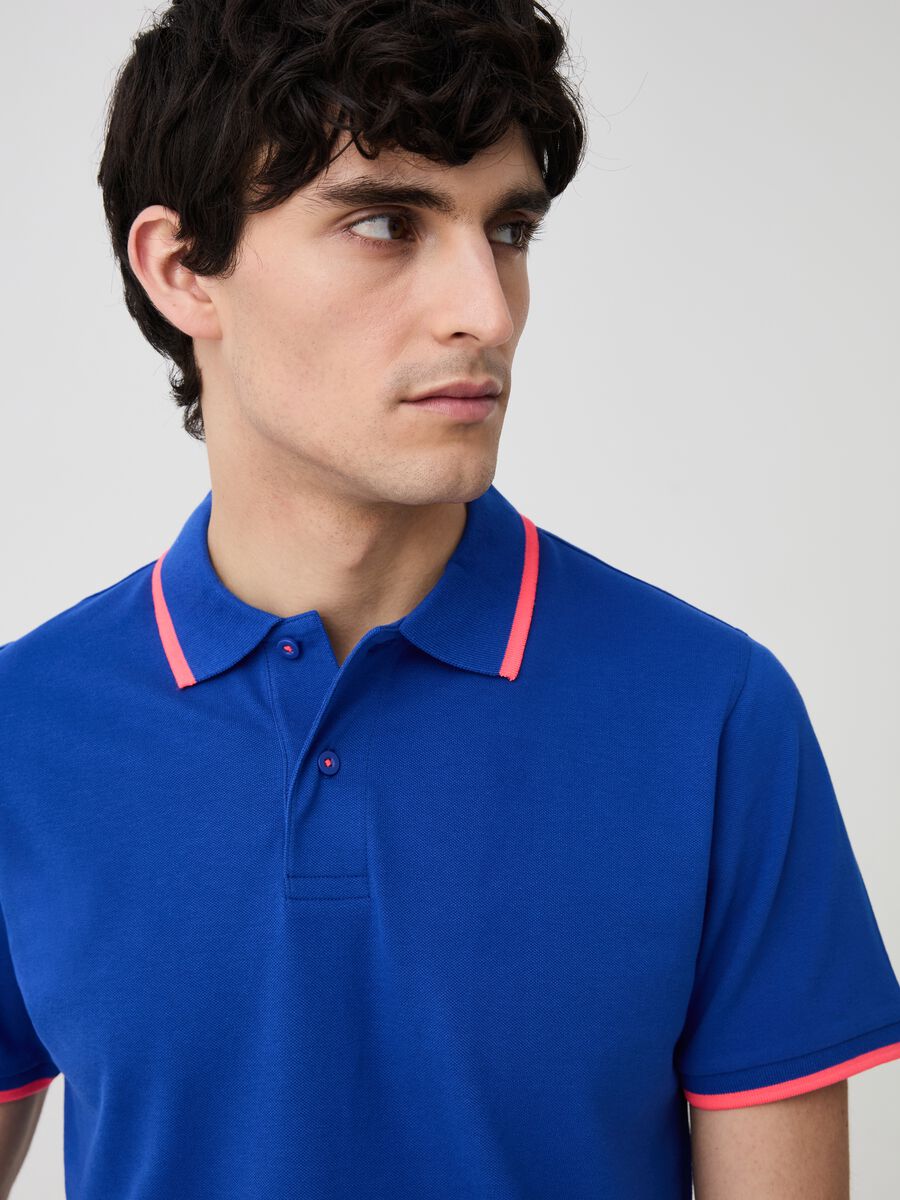 Solid colour polo shirt with fluorescent edging_1