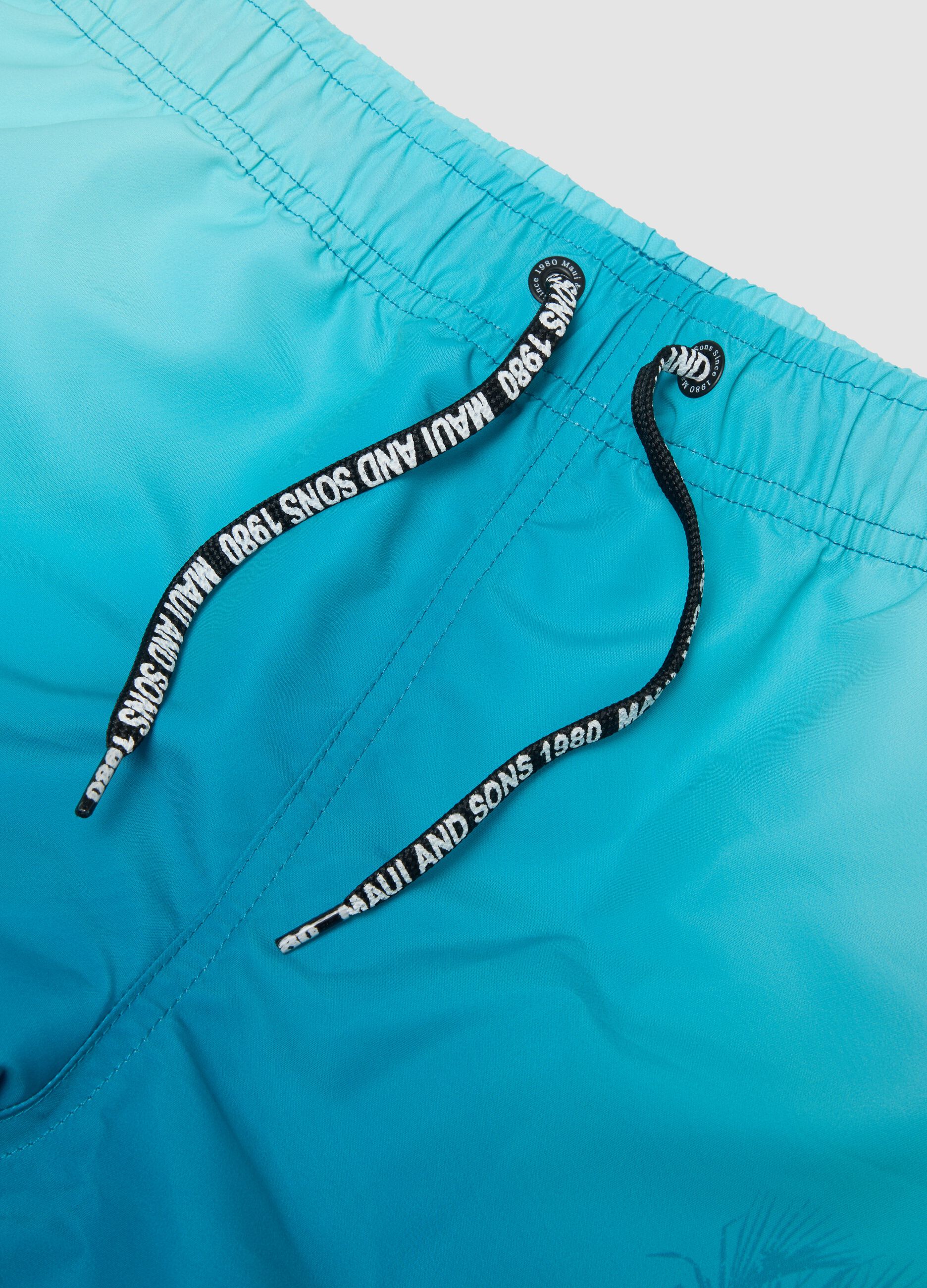 Blue tropical-print swim shorts