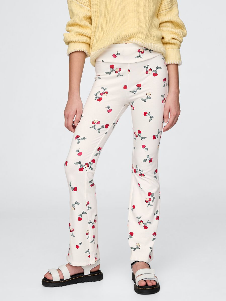 Flared trousers with floral pattern on white background_1