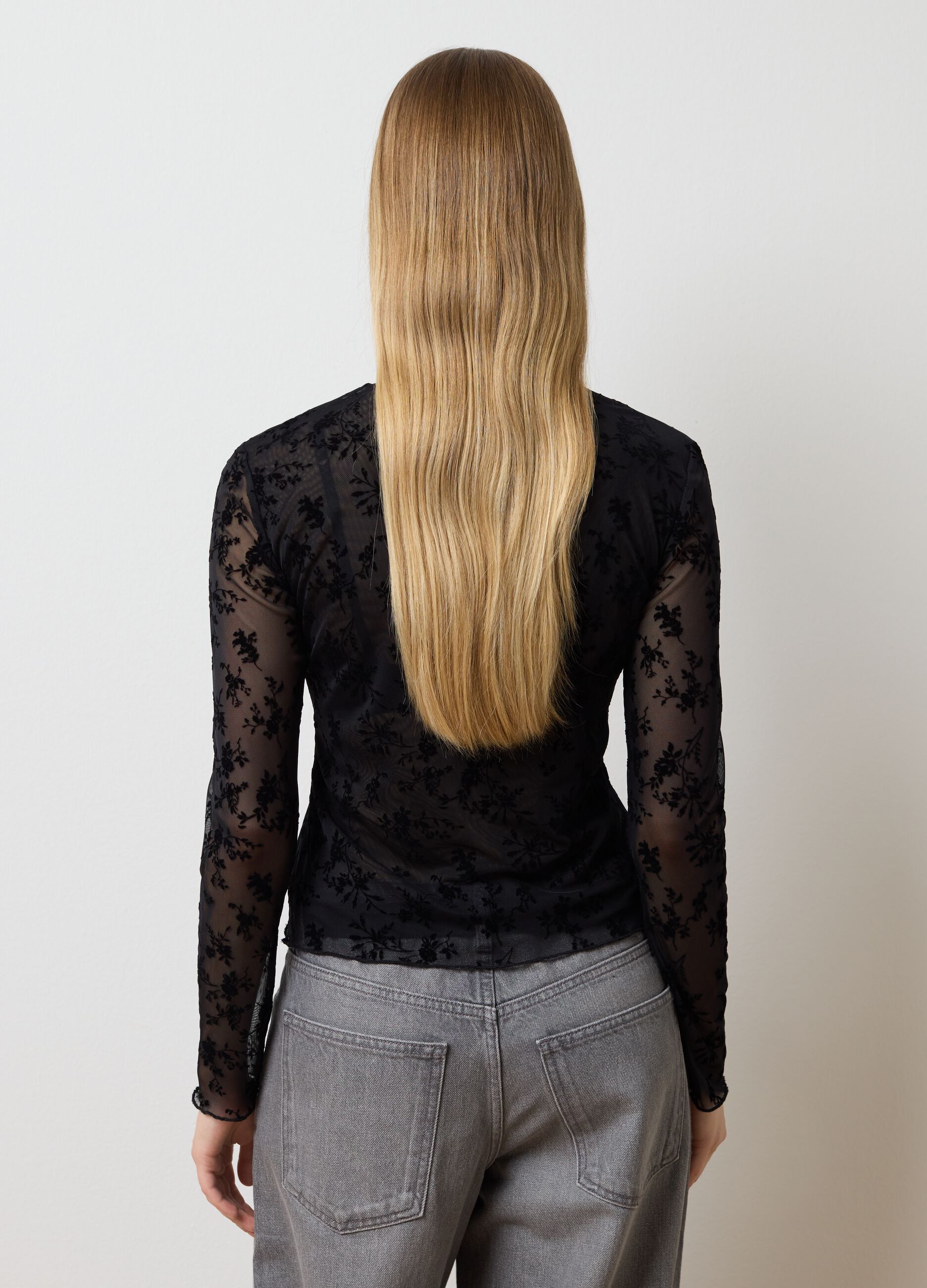 Transparent black t-shirt with floral patterns
