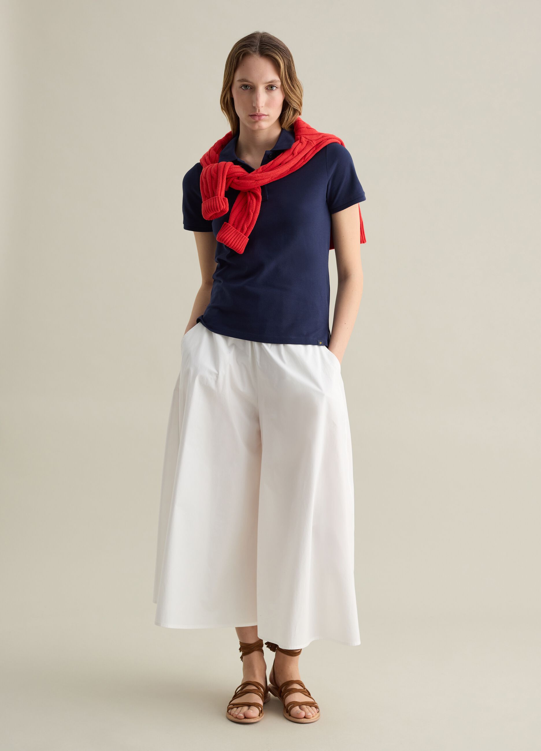 Blue short-sleeved polo shirt in piquet