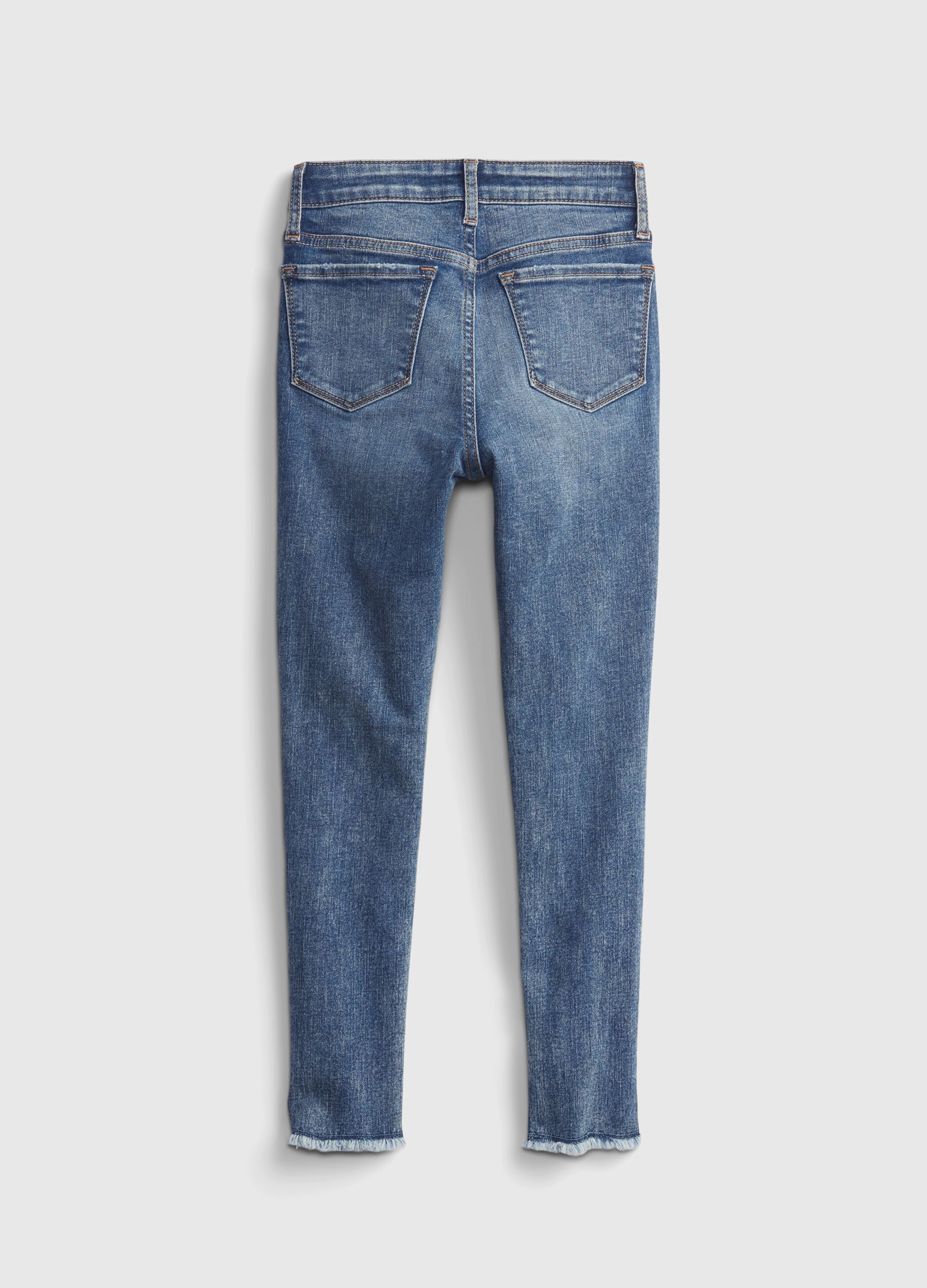High-rise jeggings with acid wash and abrasions